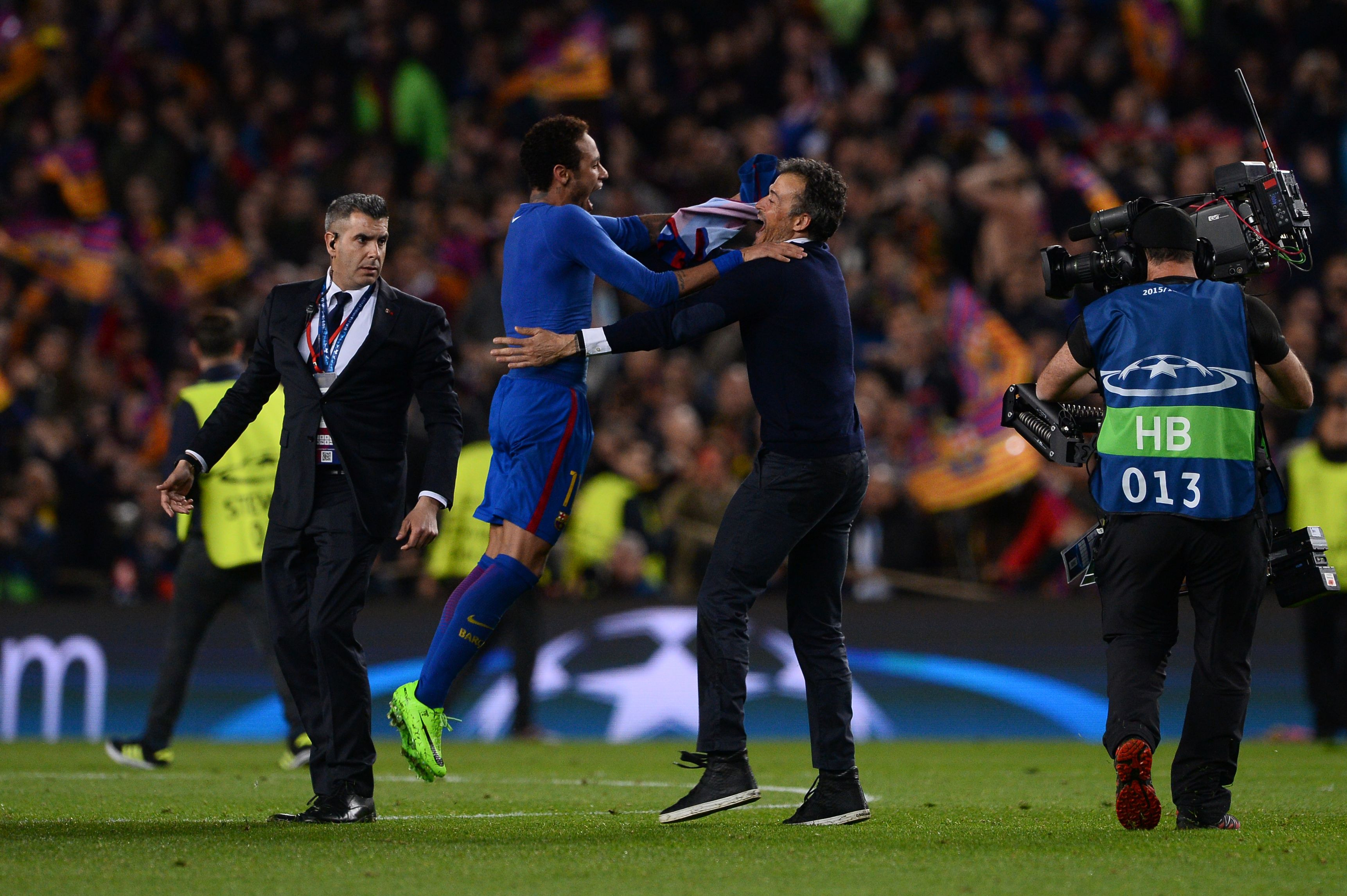 Barcelona's coach Luis Enrique (2ndR) celebrates with Barcelona's Brazilian forward Neymar their 6-1 victory at the end of the UEFA Champions League round of 16 second leg football match FC Barcelona vs Paris Saint-Germain FC at the Camp Nou stadium in Barcelona on March 8, 2017. / AFP PHOTO / Josep Lago        (Photo credit should read JOSEP LAGO/AFP/Getty Images)