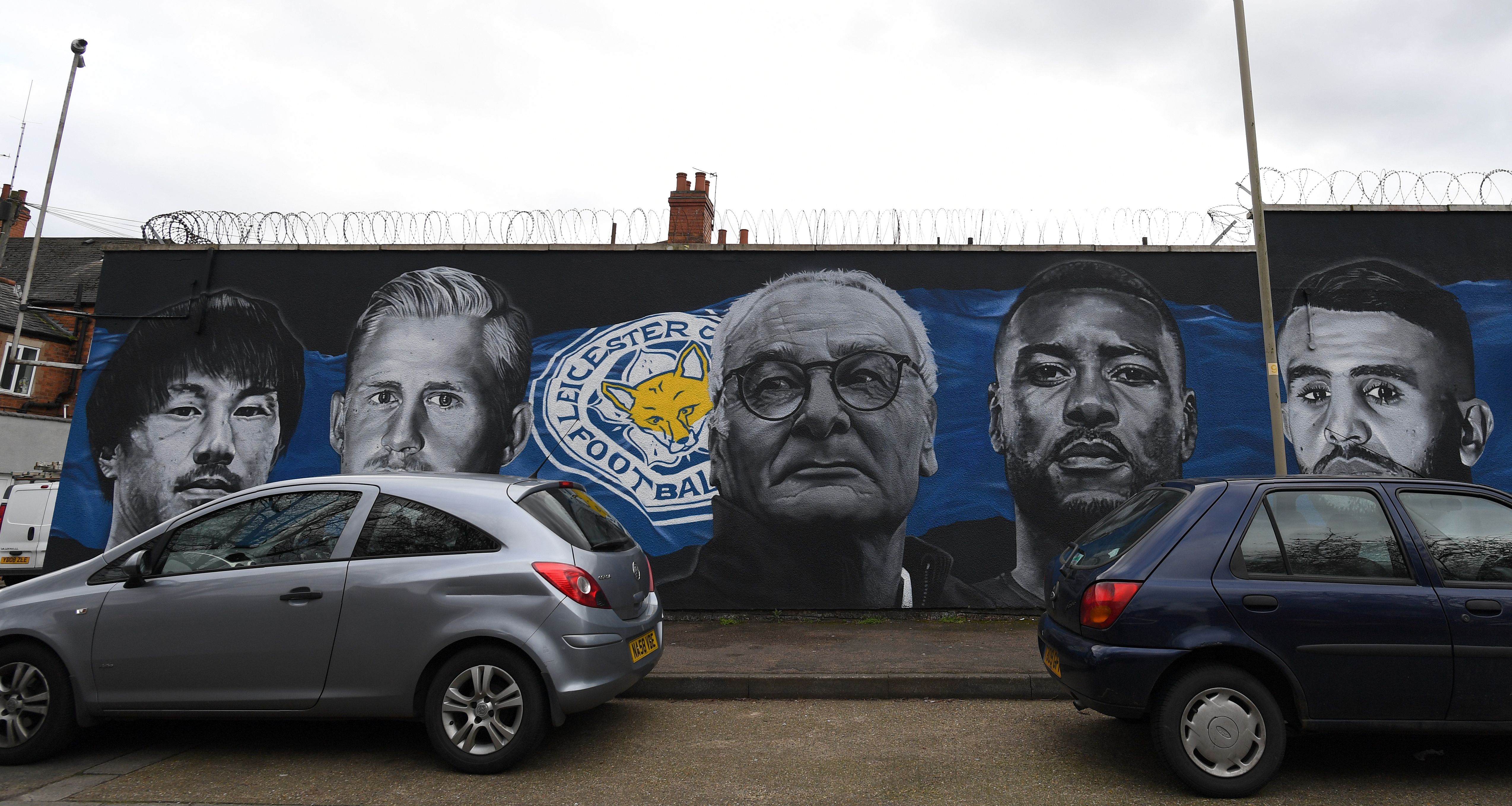 A giant mural created by artist Richard Wilson, depicts Leicester City's Japanese striker Shinji Okazaki (L), Leicester City's Danish goalkeeper Kasper Schmeichel (2L), Leicester City's former Italian manager Claudio Ranieri, (C), Leicester City's English-born Jamaican defender Wes Morgan (2R) and Leicester City's Algerian midfielder Riyad Mahrez in Leicester, central England on May 7, 2016.in Leicester, central England on March 13, 2017.
Leicester City are set to play Sevilla in a UEFA Champions League Round of 16 second leg football match on March 14.  / AFP PHOTO / Paul ELLIS / RESTRICTED TO EDITORIAL USE - MANDATORY MENTION OF THE ARTIST UPON PUBLICATION - TO ILLUSTRATE THE EVENT AS SPECIFIED IN THE CAPTION        (Photo credit should read PAUL ELLIS/AFP/Getty Images)