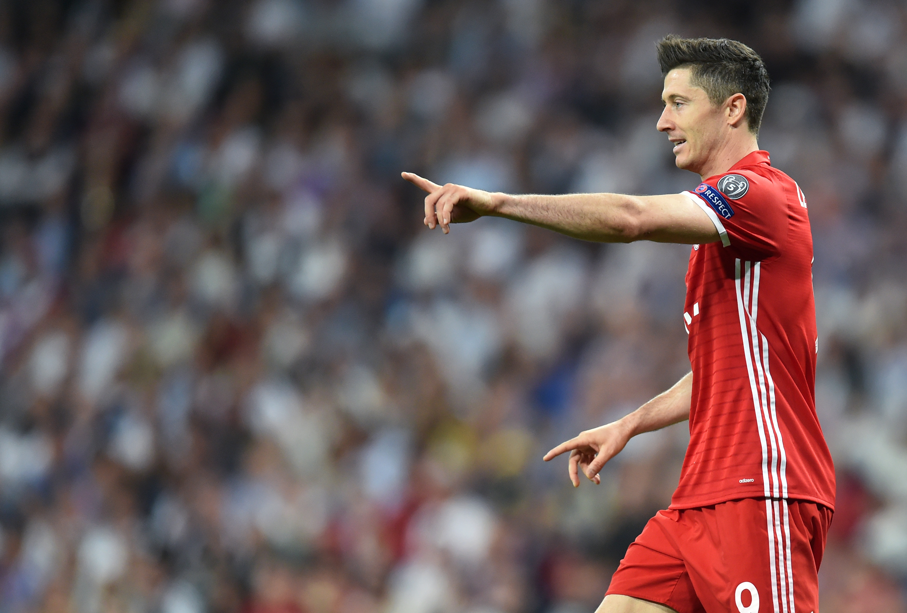 Bayern Munich's Polish striker Robert Lewandowski gestures during the UEFA Champions League quarterfinal second leg football match Real Madrid vs FC Bayern Munich at the Santiago Bernabeu stadium in Madrid, Spain, on April 18, 2017. / AFP PHOTO / Christof STACHE        (Photo credit should read CHRISTOF STACHE/AFP/Getty Images)