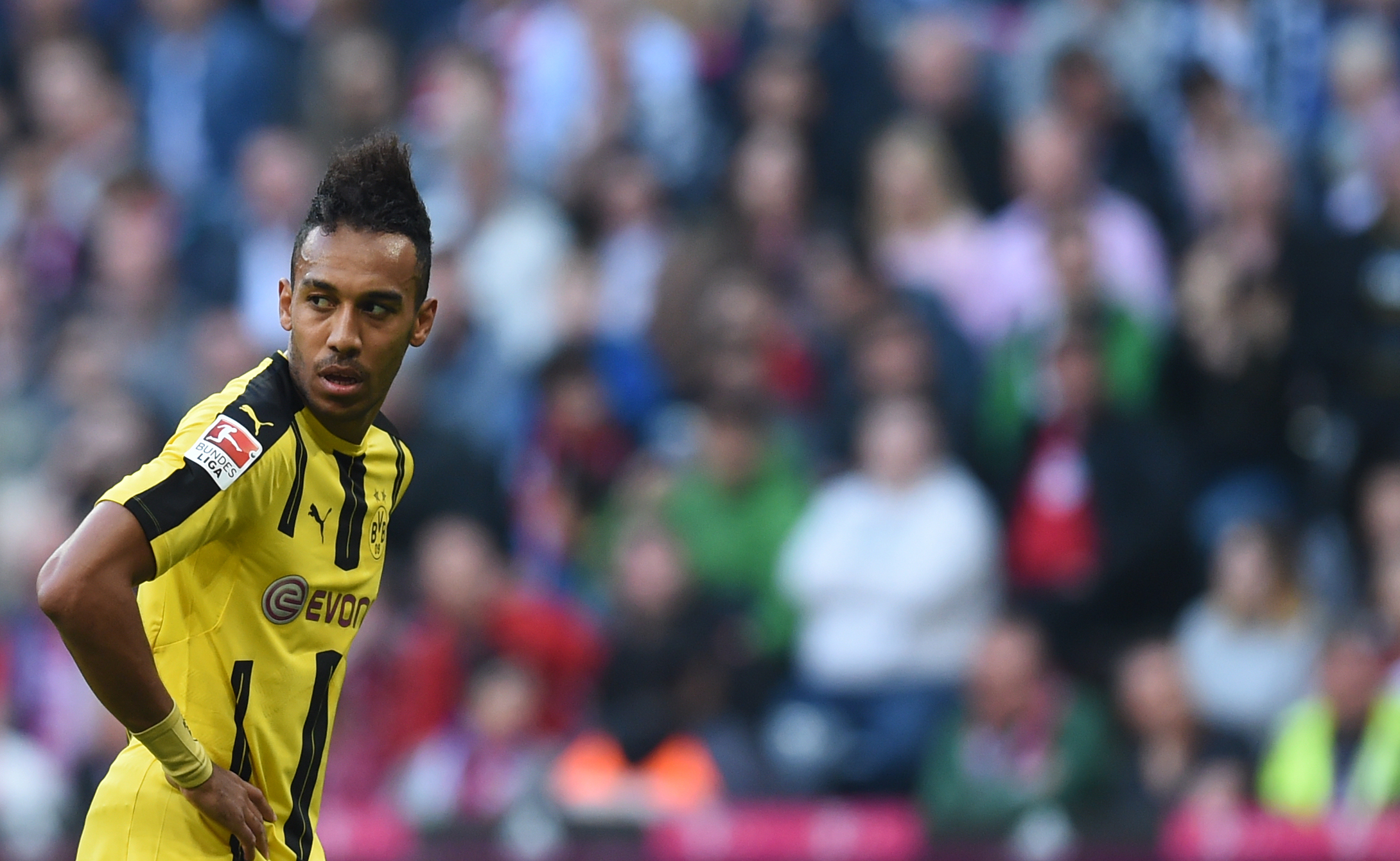 Dortmund's Gabonese striker Pierre-Emerick Aubameyang reacts during the German first division Bundesliga football match FC Bayern Munich v BVB Borussia Dortmund in Munich, southern Germany, on April 8, 2017. / AFP PHOTO / Christof STACHE / RESTRICTIONS: DURING MATCH TIME: DFL RULES TO LIMIT THE ONLINE USAGE TO 15 PICTURES PER MATCH AND FORBID IMAGE SEQUENCES TO SIMULATE VIDEO. == RESTRICTED TO EDITORIAL USE == FOR FURTHER QUERIES PLEASE CONTACT DFL DIRECTLY AT + 49 69 650050
        (Photo credit should read CHRISTOF STACHE/AFP/Getty Images)