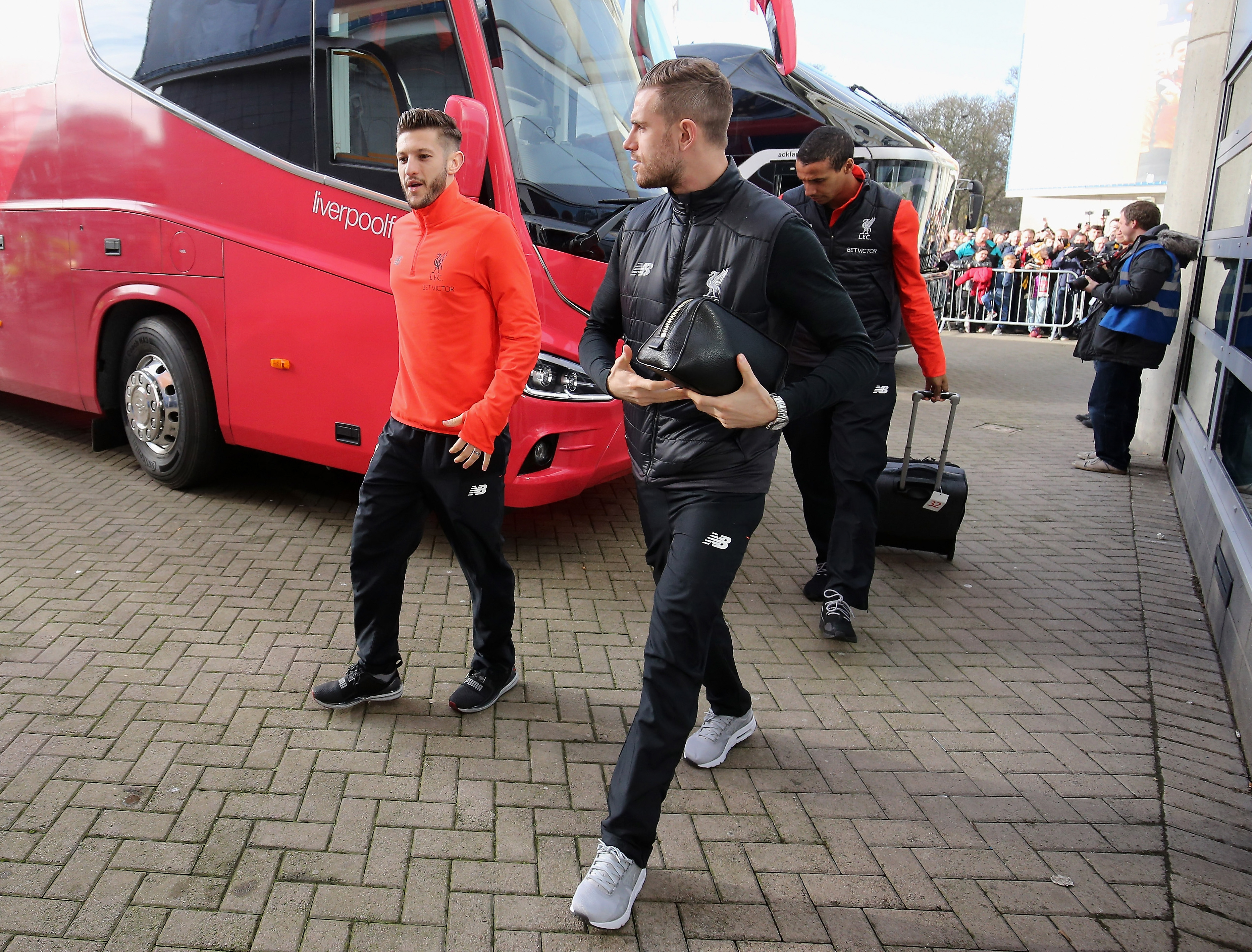 HULL, ENGLAND - FEBRUARY 04:  Adam Lallana (L) and Jordan Henderson (R) of Liverpool are seen on arrival at the stadium prior to the Premier League match between Hull City and Liverpool at KCOM Stadium on February 4, 2017 in Hull, England.  (Photo by Nigel Roddis/Getty Images)