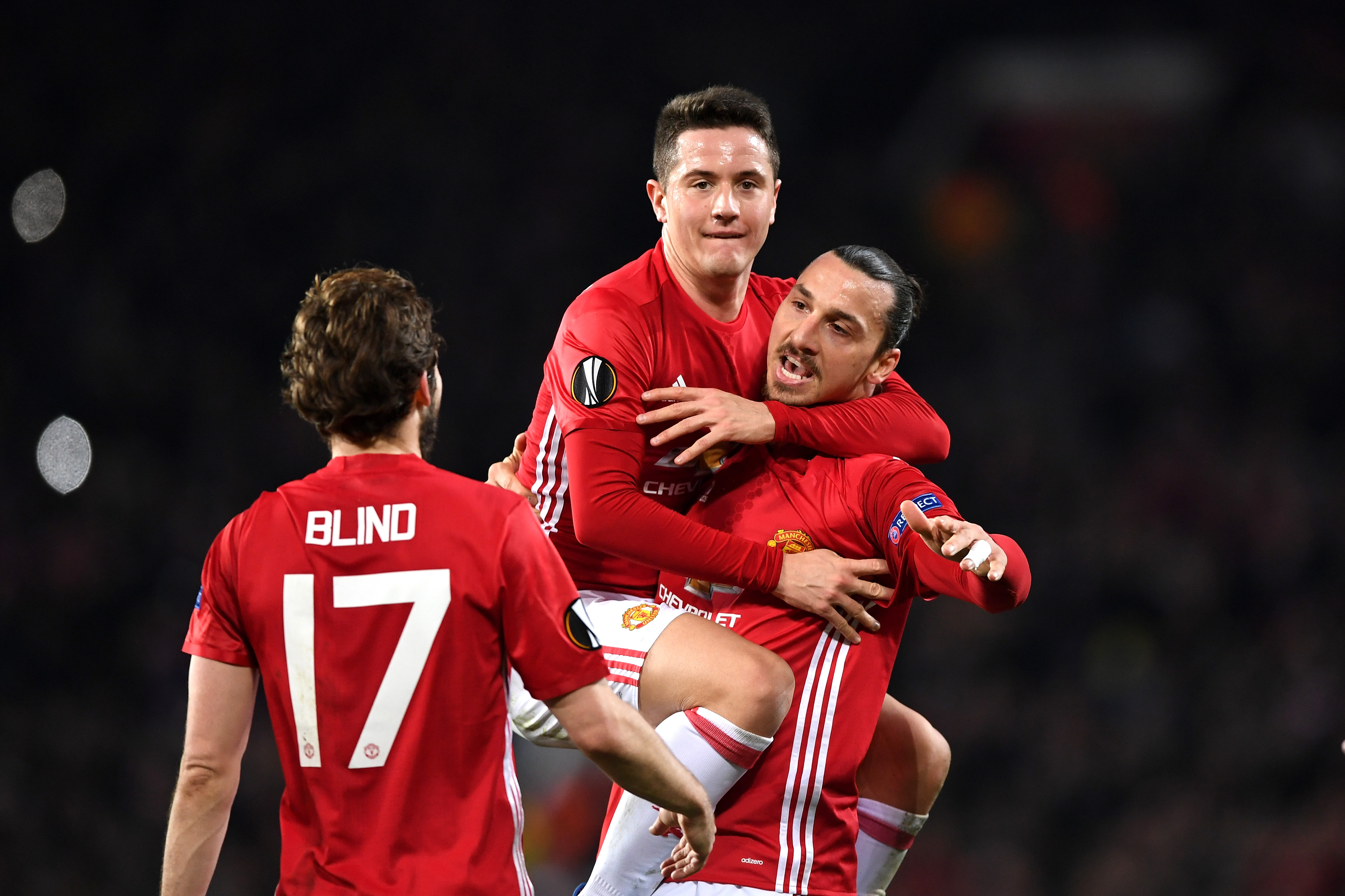 MANCHESTER, ENGLAND - FEBRUARY 16: Zlatan Ibrahimovic of Manchester United celebrates scoring his sides first goal with Ander Herrera  during the UEFA Europa  League Round of 32 first leg match between Manchester United and AS Saint-Etienne at Old Trafford on February 16, 2017 in Manchester, United Kingdom.  (Photo by Shaun Botterill/Getty Images)