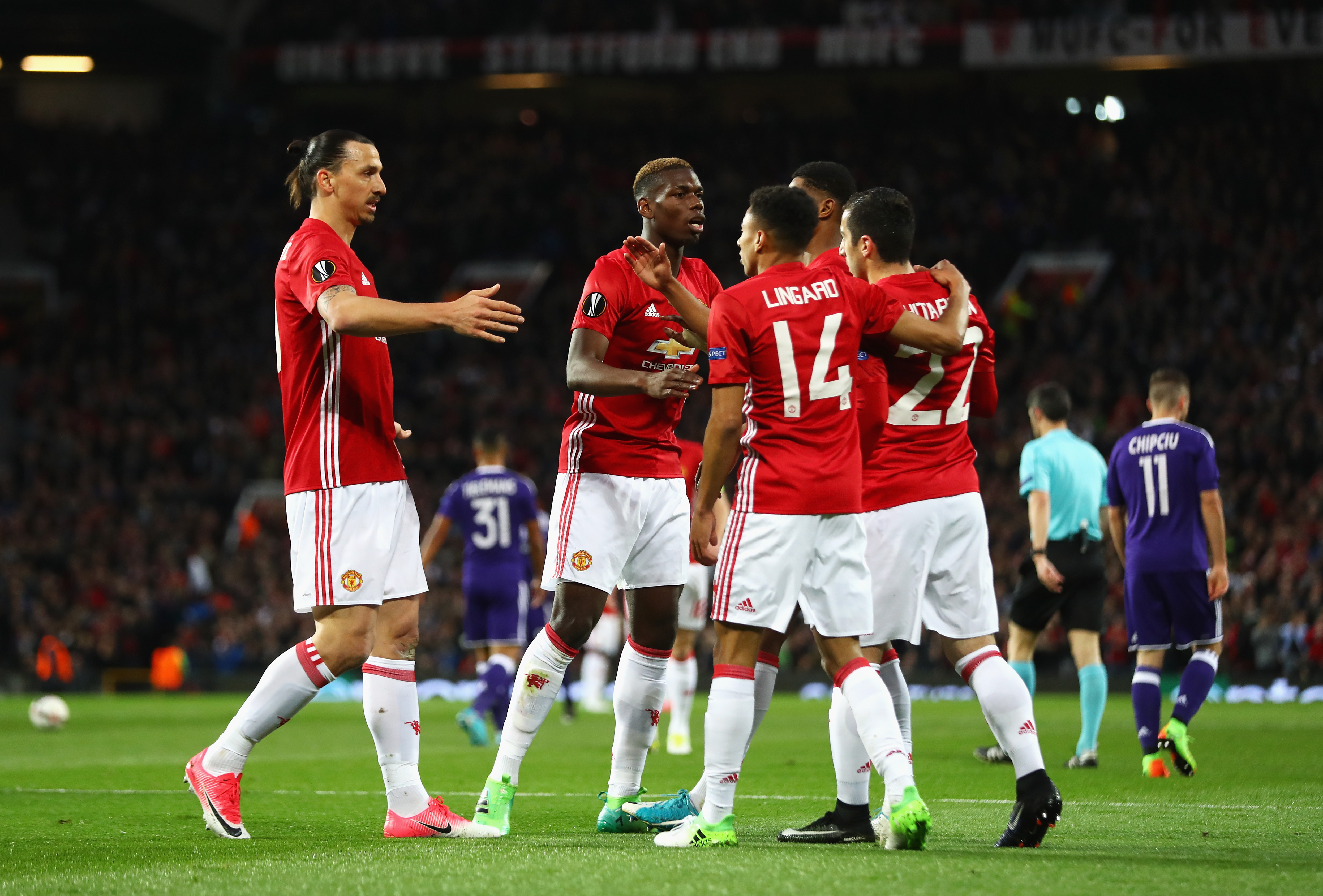 MANCHESTER, ENGLAND - APRIL 20:  Henrikh Mkhitaryan of Manchester United (22) celebrates as he scores their first goal with team matesduring the UEFA Europa League quarter final second leg match between Manchester United and RSC Anderlecht at Old Trafford on April 20, 2017 in Manchester, United Kingdom.  (Photo by Michael Steele/Getty Images)