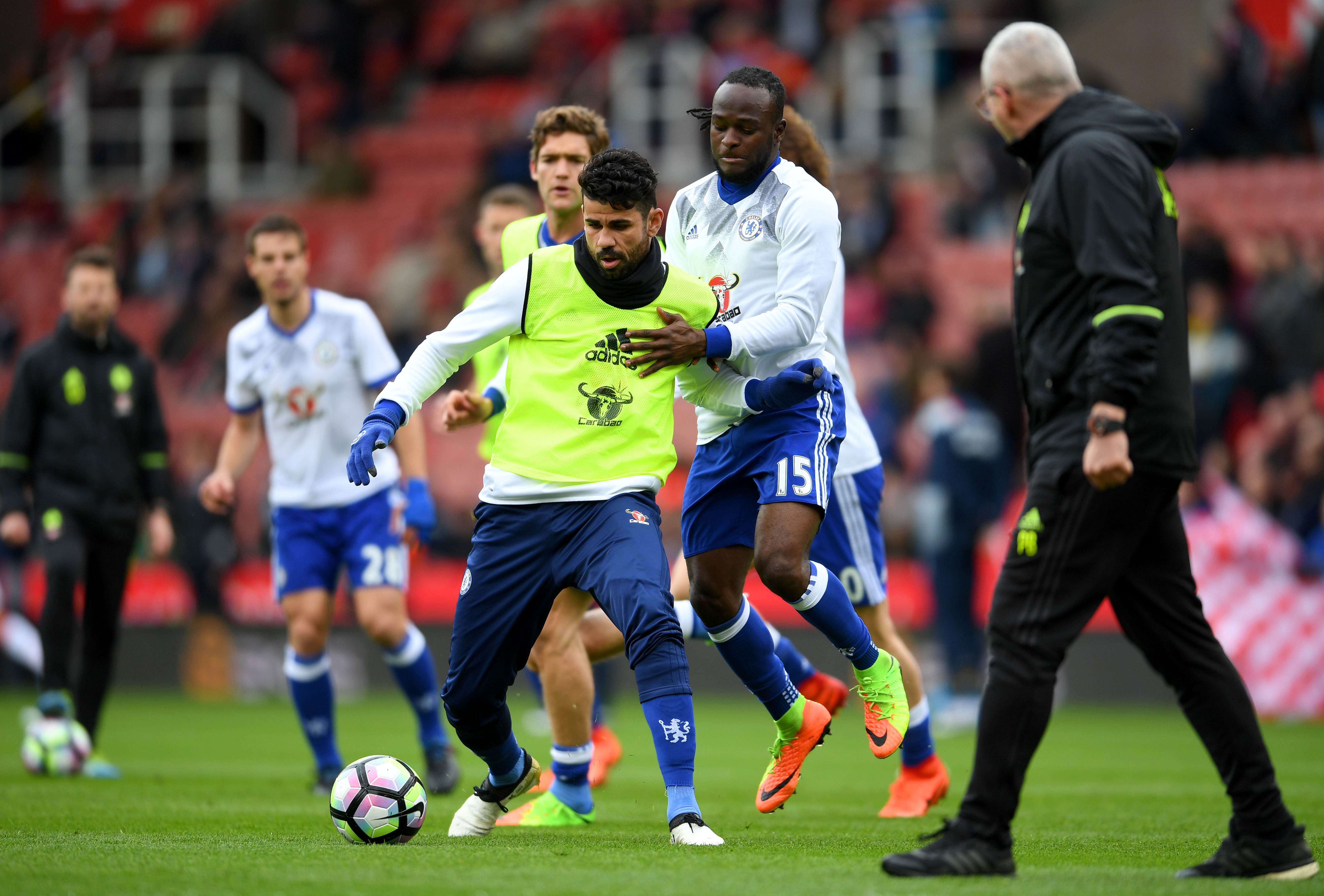 STOKE ON TRENT, ENGLAND - MARCH 18: Diego Costa of Chelsea (L) and Victor Moses of Chelsea (R) battle for possession during the warm up prior to the Premier League match between Stoke City and Chelsea at Bet365 Stadium on March 18, 2017 in Stoke on Trent, England.  (Photo by Laurence Griffiths/Getty Images)