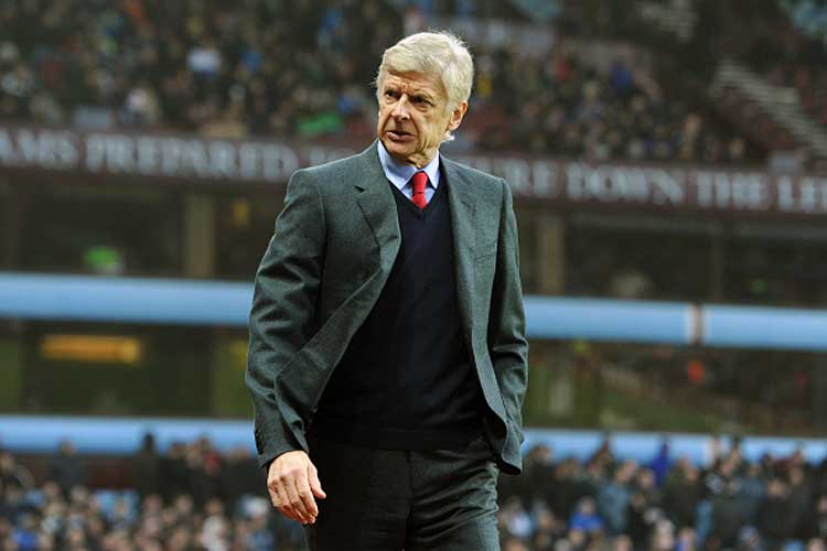 Arsenal manager Arsene Wenger reacts during a game. (Courtesy: Getty)