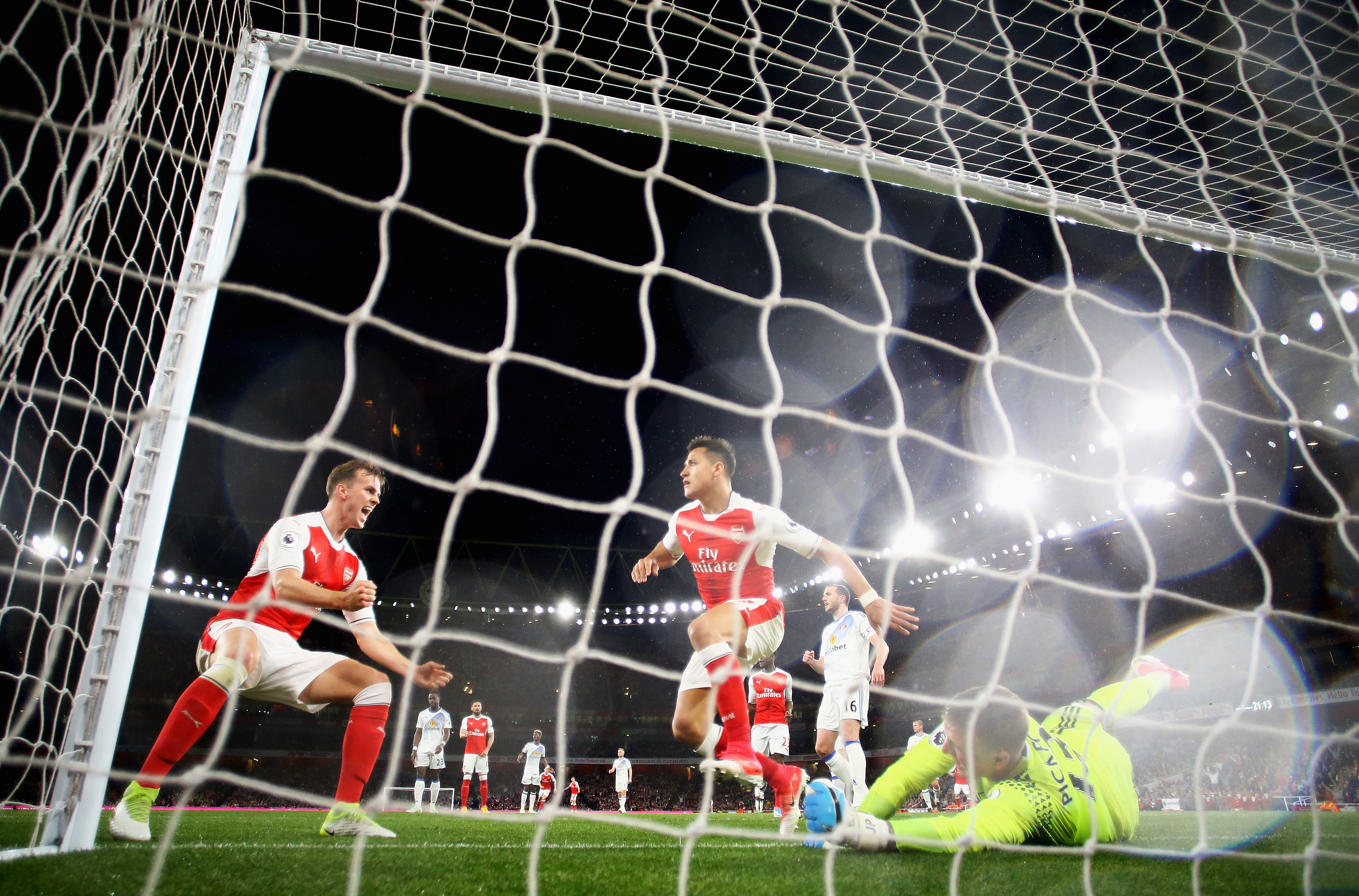 LONDON, ENGLAND - MAY 16:  Alexis Sanchez of Arsenal scores his sides first goal past Jordan Pickford of Sunderland during the Premier League match between Arsenal and Sunderland at Emirates Stadium on May 16, 2017 in London, England.  (Photo by Richard Heathcote/Getty Images)