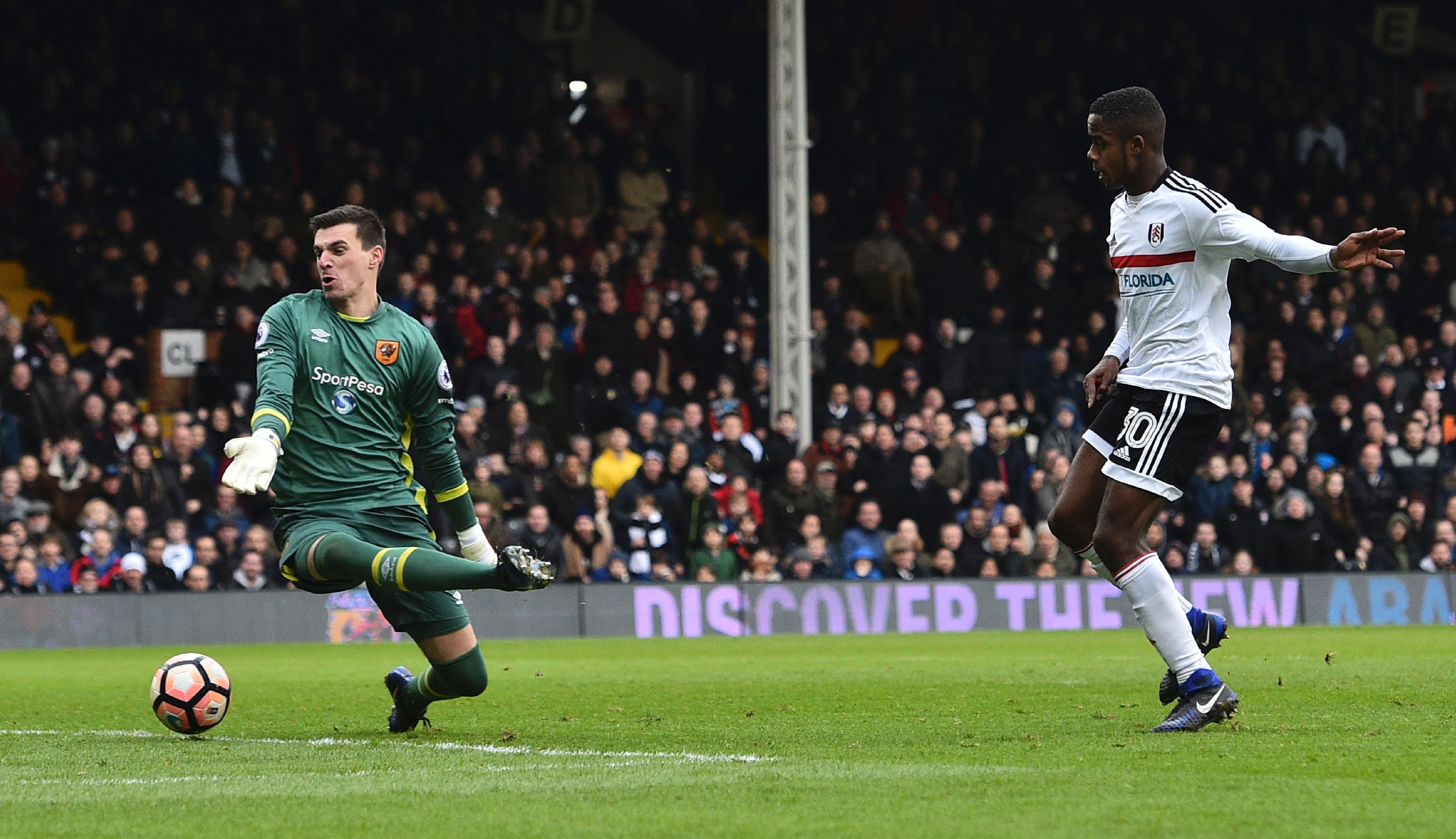 Fulham's English defender Ryan Sessegnon (R) scores their third goal during the English FA Cup fourth round football match between Fulham and Hull City at Craven Cottage in London on January 29, 2017. / AFP / Glyn KIRK / RESTRICTED TO EDITORIAL USE. No use with unauthorized audio, video, data, fixture lists, club/league logos or 'live' services. Online in-match use limited to 75 images, no video emulation. No use in betting, games or single club/league/player publications.  /         (Photo credit should read GLYN KIRK/AFP/Getty Images)