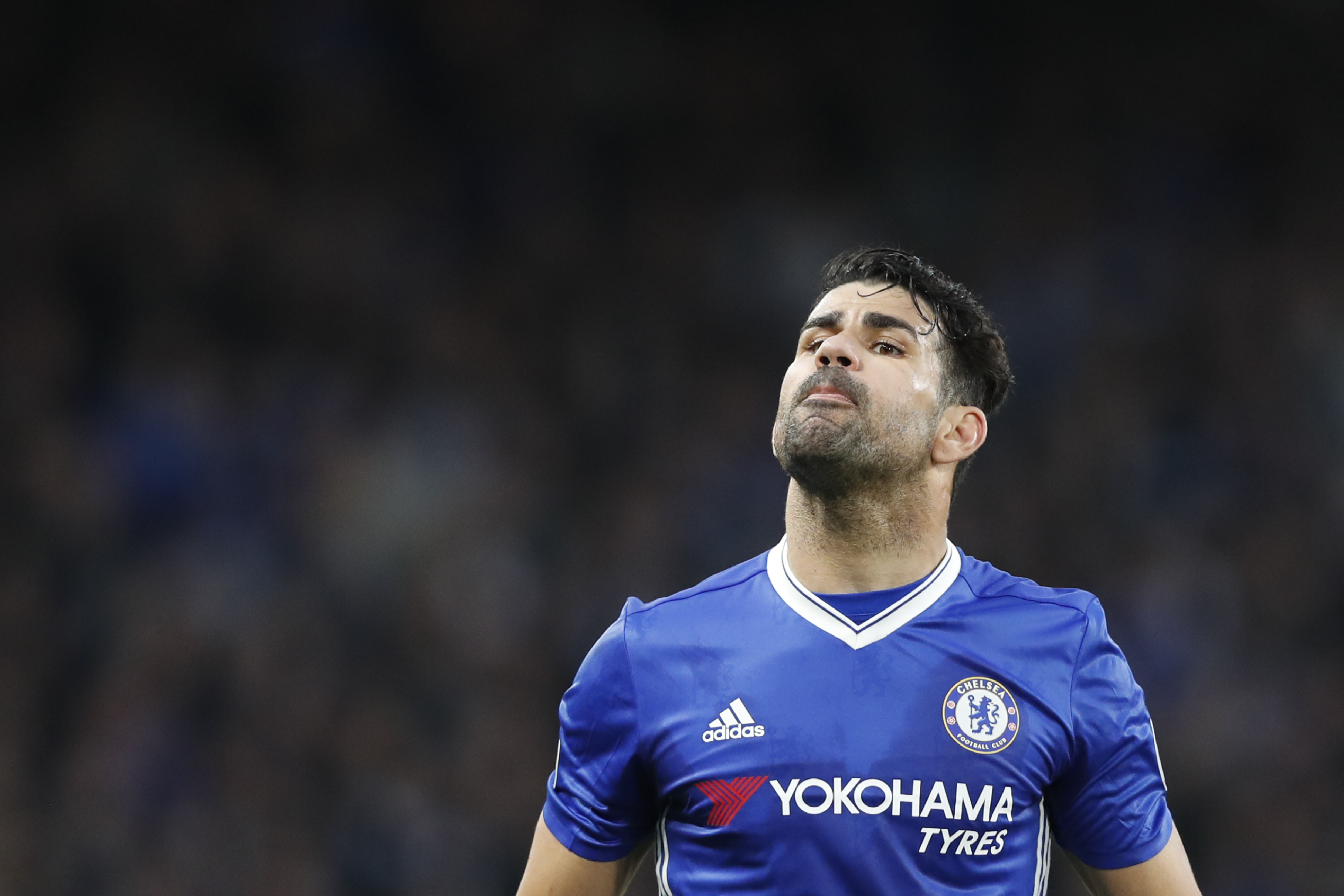 Chelsea's Brazilian-born Spanish striker Diego Costa gestures during the English Premier League football match between Chelsea and Middlesbrough at Stamford Bridge in London on May 8, 2017. / AFP PHOTO / Adrian DENNIS / RESTRICTED TO EDITORIAL USE. No use with unauthorized audio, video, data, fixture lists, club/league logos or 'live' services. Online in-match use limited to 75 images, no video emulation. No use in betting, games or single club/league/player publications.  /         (Photo credit should read ADRIAN DENNIS/AFP/Getty Images)