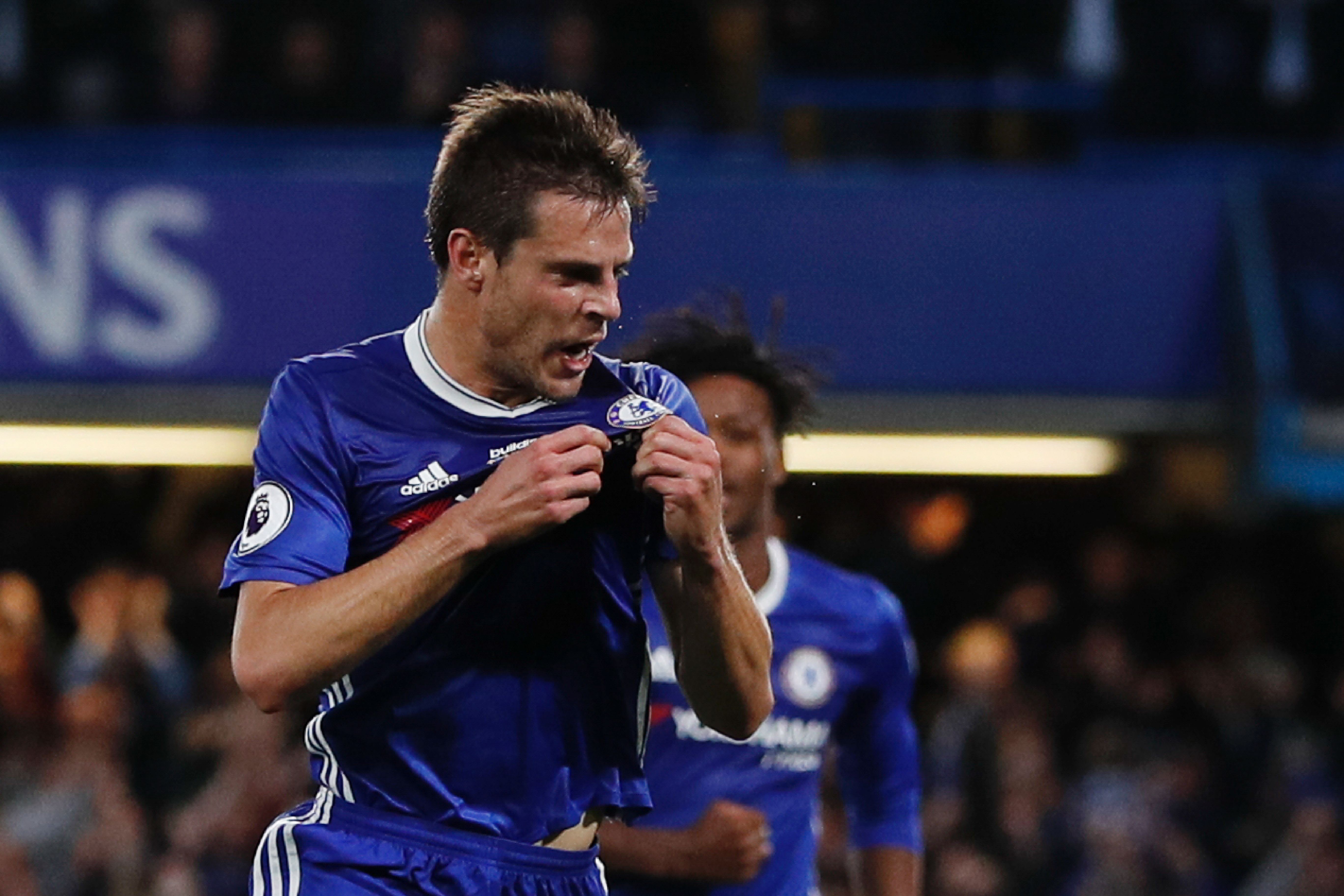 Chelsea's Spanish defender Cesar Azpilicueta celebrates scoring their second goal during the English Premier League football match between Chelsea and Watford at Stamford Bridge in London on May 15, 2017. / AFP PHOTO / Adrian DENNIS / RESTRICTED TO EDITORIAL USE. No use with unauthorized audio, video, data, fixture lists, club/league logos or 'live' services. Online in-match use limited to 75 images, no video emulation. No use in betting, games or single club/league/player publications.  /         (Photo credit should read ADRIAN DENNIS/AFP/Getty Images)