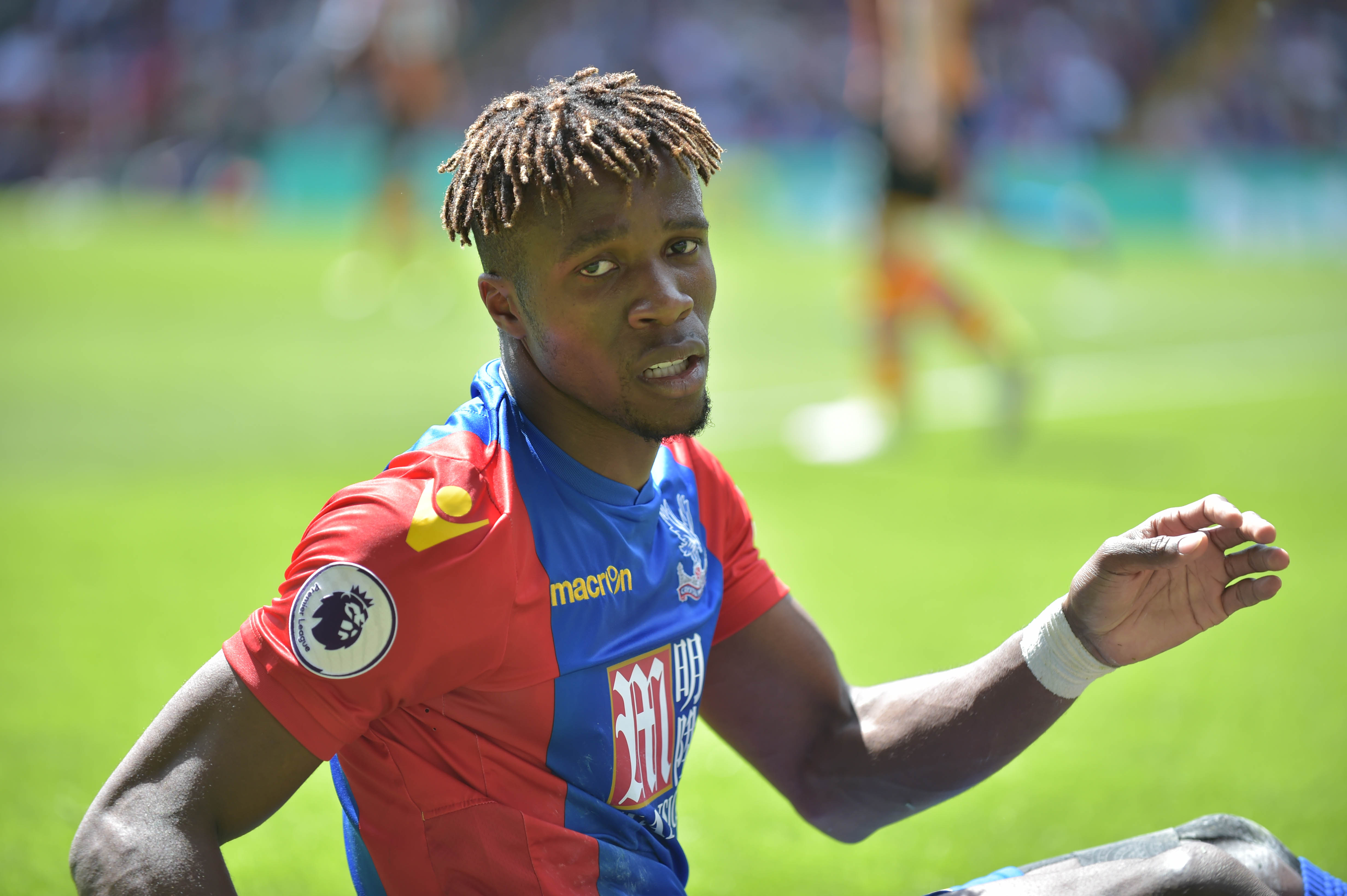 Crystal Palace's Ivorian striker Wilfried Zaha looks on during the English Premier League football match between Crystal Palace and Hull City at Selhurst Park in south London on May 14, 2017 / AFP PHOTO / OLLY GREENWOOD / RESTRICTED TO EDITORIAL USE. No use with unauthorized audio, video, data, fixture lists, club/league logos or 'live' services. Online in-match use limited to 75 images, no video emulation. No use in betting, games or single club/league/player publications.  /         (Photo credit should read OLLY GREENWOOD/AFP/Getty Images)