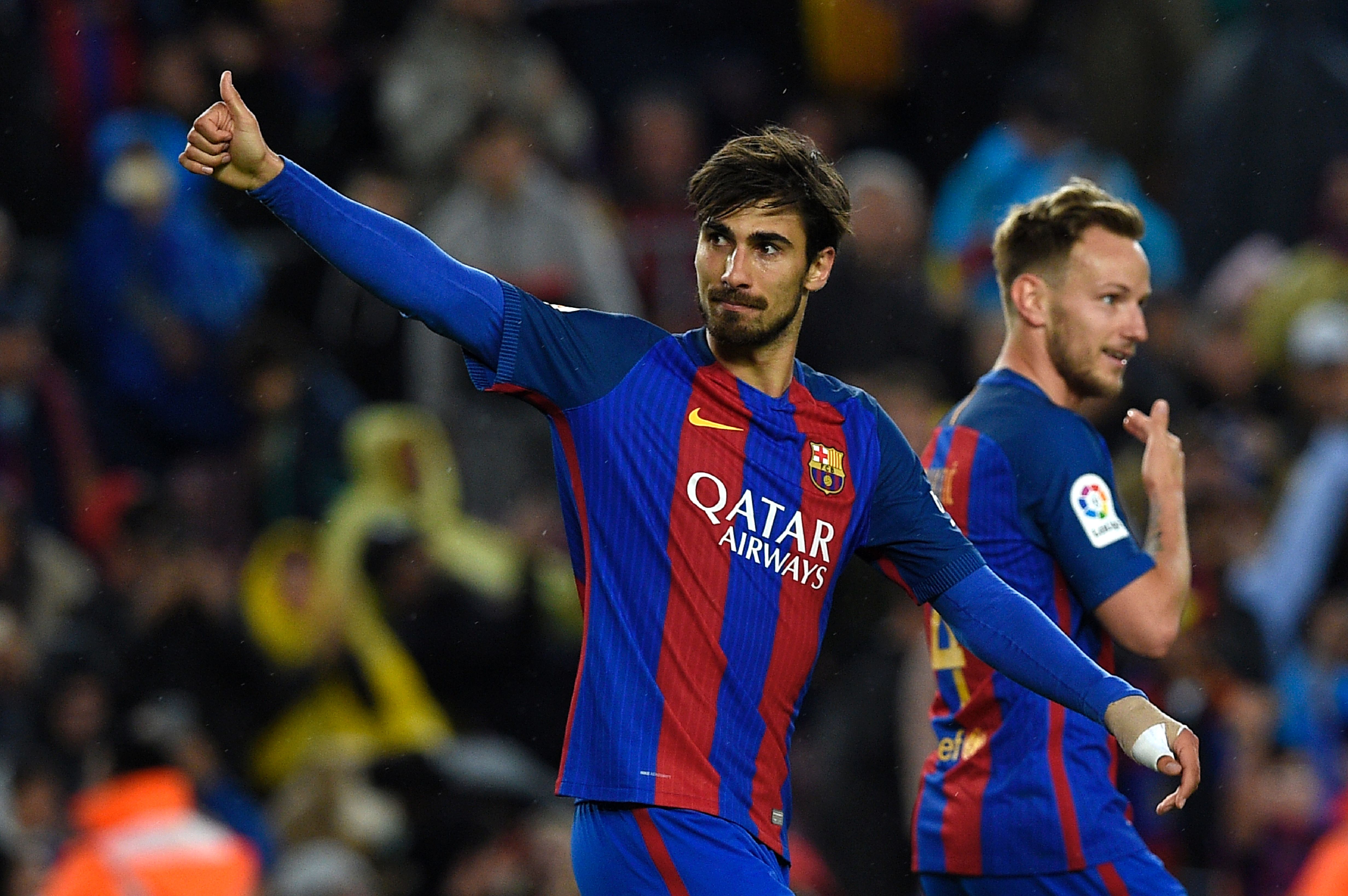 Barcelona's Portuguese midfielder Andre Gomes (L) celebrates after scoring a goal during the Spanish league football match FC Barcelona vs CA Osasuna at the Camp Nou stadium in Barcelona on April 26, 2017. / AFP PHOTO / LLUIS GENE        (Photo credit should read LLUIS GENE/AFP/Getty Images)
