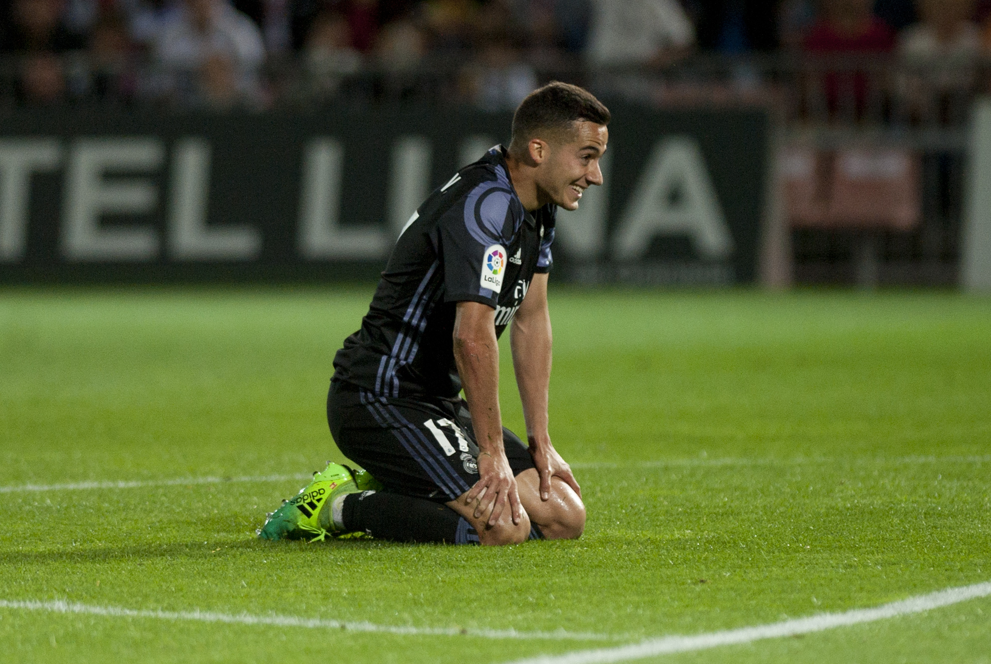 Real Madrid's forward Lucas Vazquez kneels on the field during the Spanish league football match Granada FC vs Real Madrid CF at Nuevo Los Carmenes stadium in Granada on May 6, 2017. / AFP PHOTO / SERGIO CAMACHO        (Photo credit should read SERGIO CAMACHO/AFP/Getty Images)