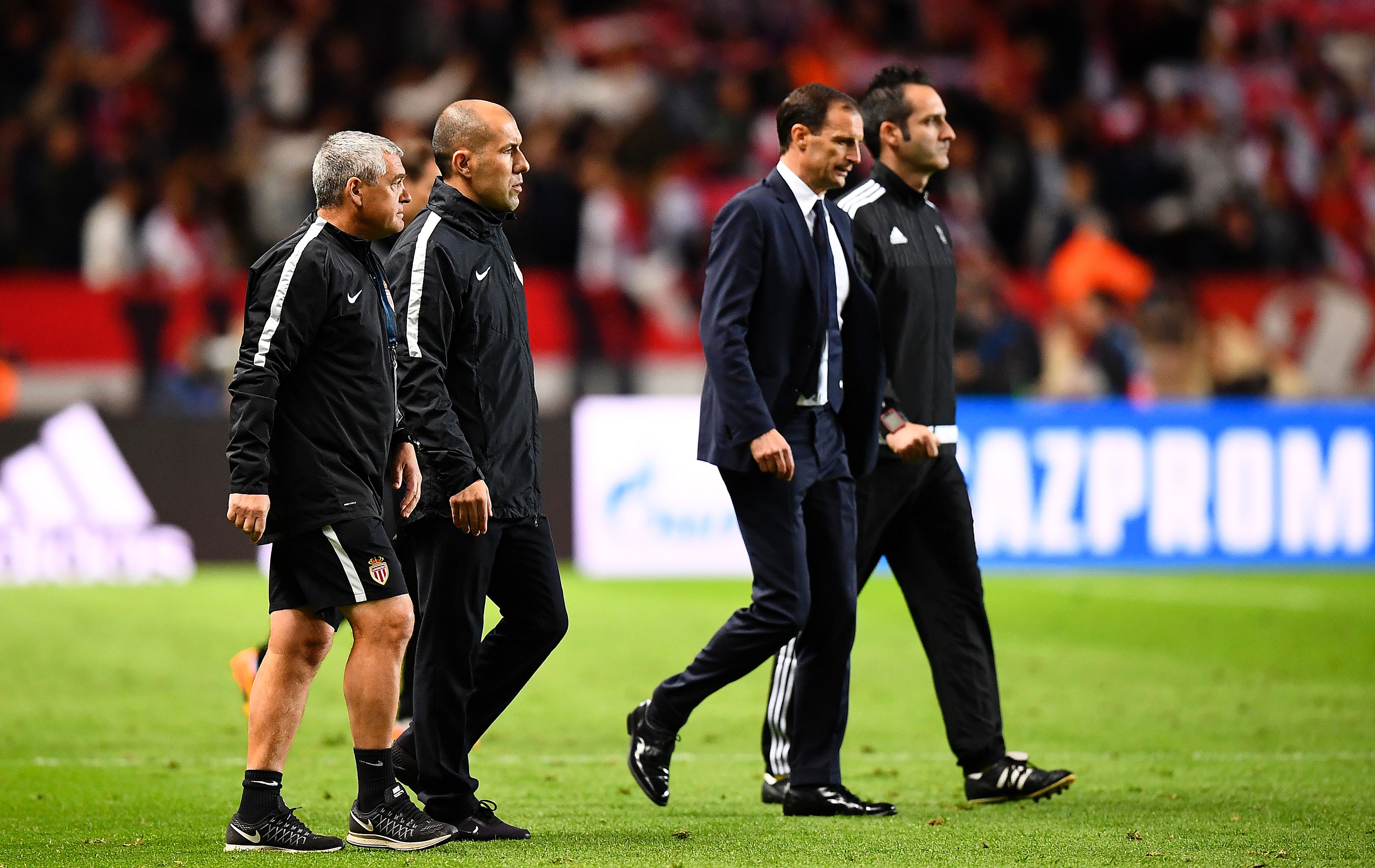 Juventus' Italian head coach Massimiliano Allegri (C) and Monaco's Portuguese coach Leonardo Jardim (L) leave the pitch during the UEFA Champions League semi-final first leg football match between Monaco and Juventus at Stade Louis II Stadium in Monaco on May 3, 2017.   / AFP PHOTO / FRANCK FIFE        (Photo credit should read FRANCK FIFE/AFP/Getty Images)