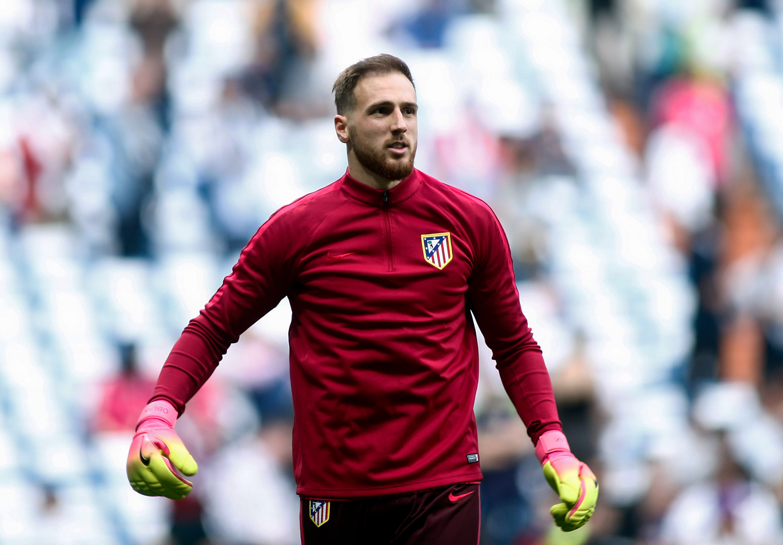 Atletico Madrid's Slovenian goalkeeper Jan Oblak warms up before the UEFA Champions League semifinal first leg football match Real Madrid CF vs Club Atletico de Madrid at the Santiago Bernabeu stadium in Madrid, on May 2, 2017. / AFP PHOTO / OSCAR DEL POZO        (Photo credit should read OSCAR DEL POZO/AFP/Getty Images)