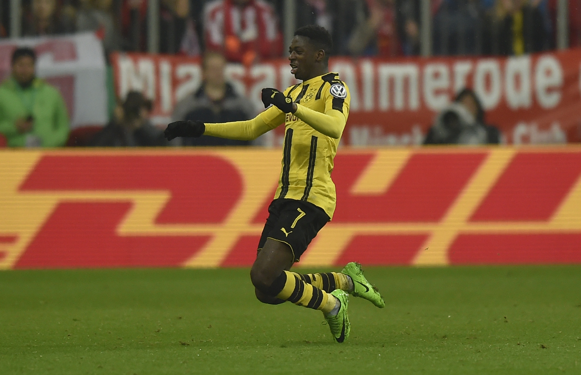 Dortmund's French midfielder Ousmane Dembele celebrate after the second goal for Dortmund during the German Cup DFB Pokal semifinal football match between FC Bayern Munich and BVB Borussia Dortmund in Munich, on April 26, 2017. / AFP PHOTO / GUENTER SCHIFFMANN / RESTRICTIONS: ACCORDING TO DFB RULES IMAGE SEQUENCES TO SIMULATE VIDEO IS NOT ALLOWED DURING MATCH TIME. MOBILE (MMS) USE IS NOT ALLOWED DURING AND FOR FURTHER TWO HOURS AFTER THE MATCH. == RESTRICTED TO EDITORIAL USE == FOR MORE INFORMATION CONTACT DFB DIRECTLY AT +49 69 67880

 /         (Photo credit should read GUENTER SCHIFFMANN/AFP/Getty Images)