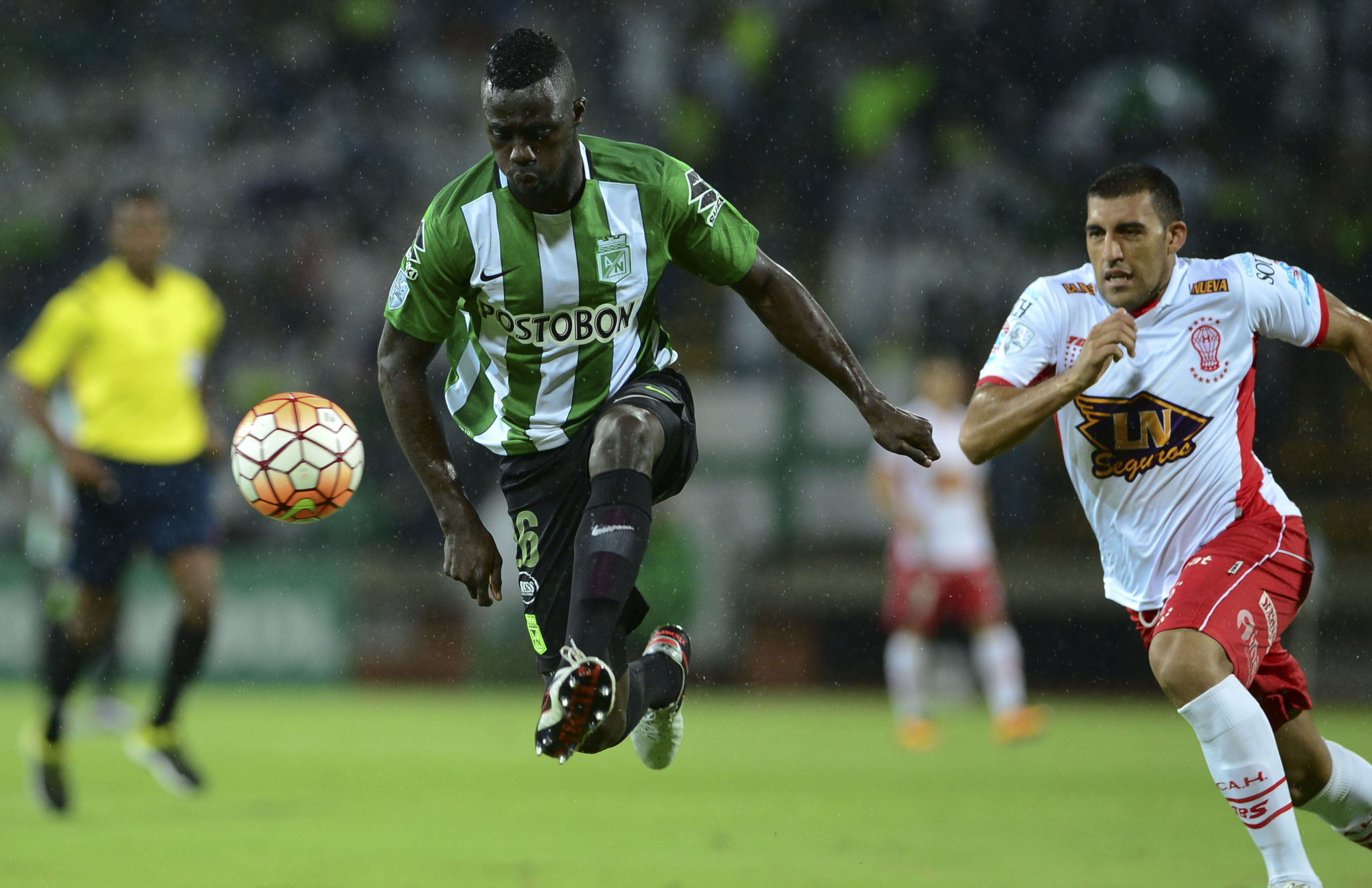 Colombia's Atletico Nacional player   Davinson Sanchez (L) vies for the ball with Argentina's Huracan player Ramon Abila during their Copa Libertadores 2016 football match at Atanasio Girardot  stadium in Medellin, Antioquia department, Colombia, on May 3, 2016. / AFP / RAUL ARBOLEDA        (Photo credit should read RAUL ARBOLEDA/AFP/Getty Images)