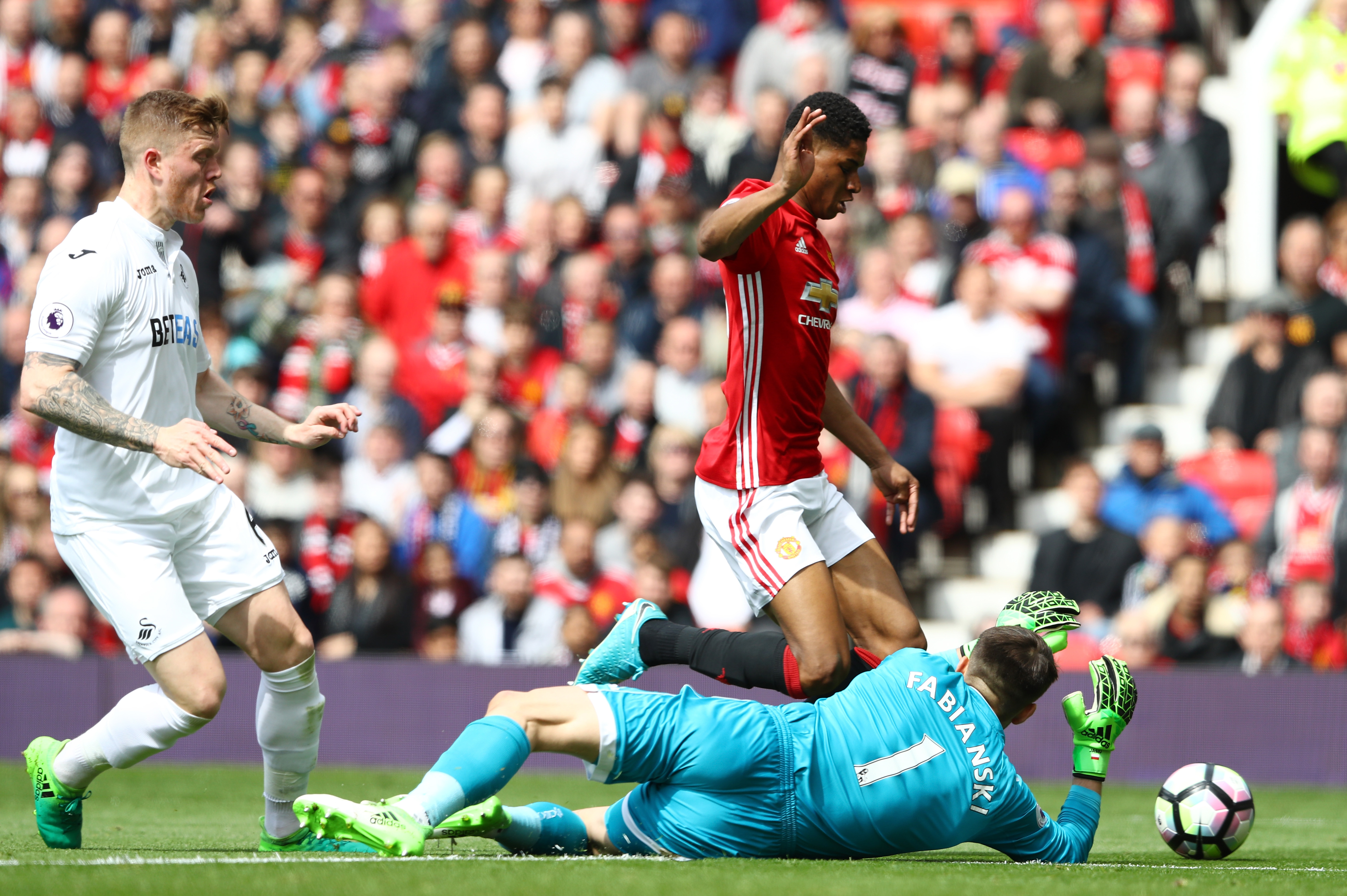 MANCHESTER, ENGLAND - APRIL 30:  Marcus Rashford of Manchester United is fouled by Lukasz Fabianski of Swansea City and a penalty is awarded to Manchester United during the Premier League match between Manchester United and Swansea City at Old Trafford on April 30, 2017 in Manchester, England.  (Photo by Michael Steele/Getty Images)