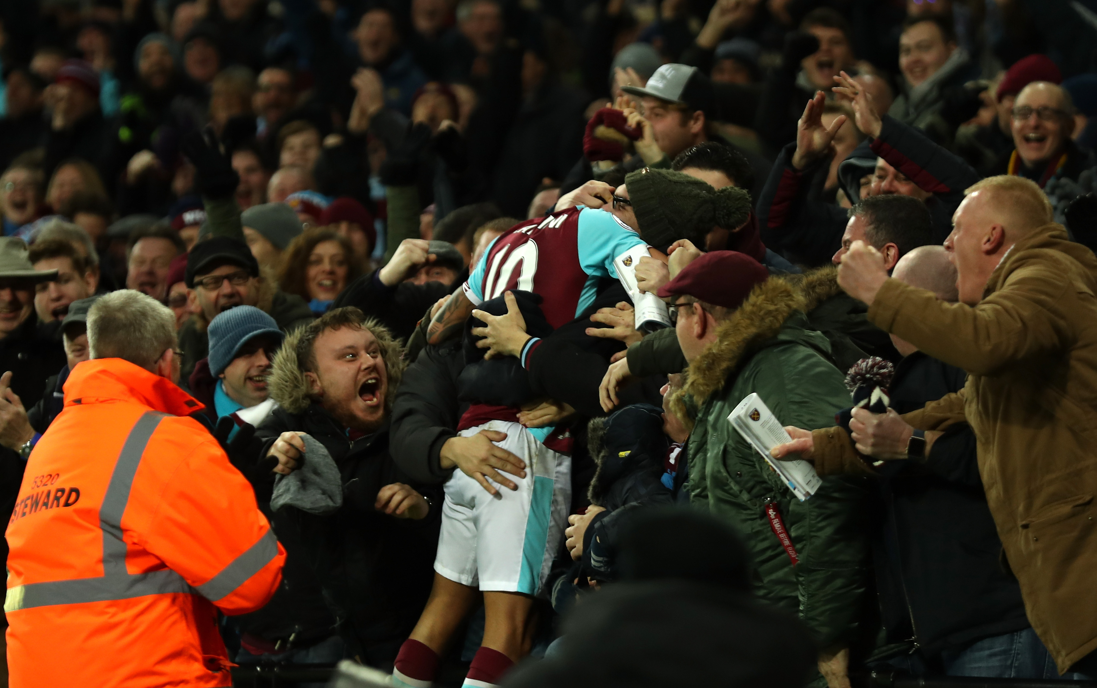 LONDON, ENGLAND - JANUARY 14: Manuel Lanzini of West Ham United celebrates scoring his sides third goal with the West Ham United fans during the Premier League match between West Ham United and Crystal Palace at London Stadium on January 14, 2017 in London, England.  (Photo by Bryn Lennon/Getty Images)