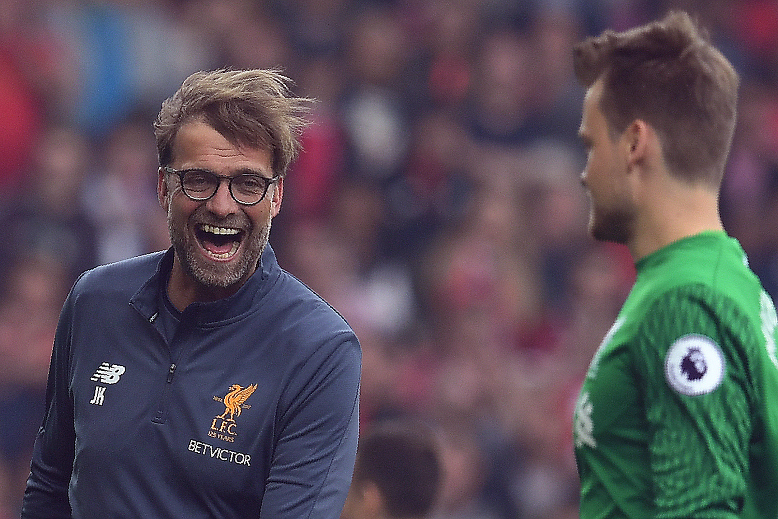 Liverpool's German manager Jurgen Klopp (L) reacts with Liverpool's Belgian goalkeeper Simon Mignolet during the English Premier League football match between Liverpool and Middlesbrough at Anfield in Liverpool, north west England on May 21, 2017.
Liverpool won the match 3-0. / AFP PHOTO / Paul ELLIS / RESTRICTED TO EDITORIAL USE. No use with unauthorized audio, video, data, fixture lists, club/league logos or 'live' services. Online in-match use limited to 75 images, no video emulation. No use in betting, games or single club/league/player publications.  /         (Photo credit should read PAUL ELLIS/AFP/Getty Images)