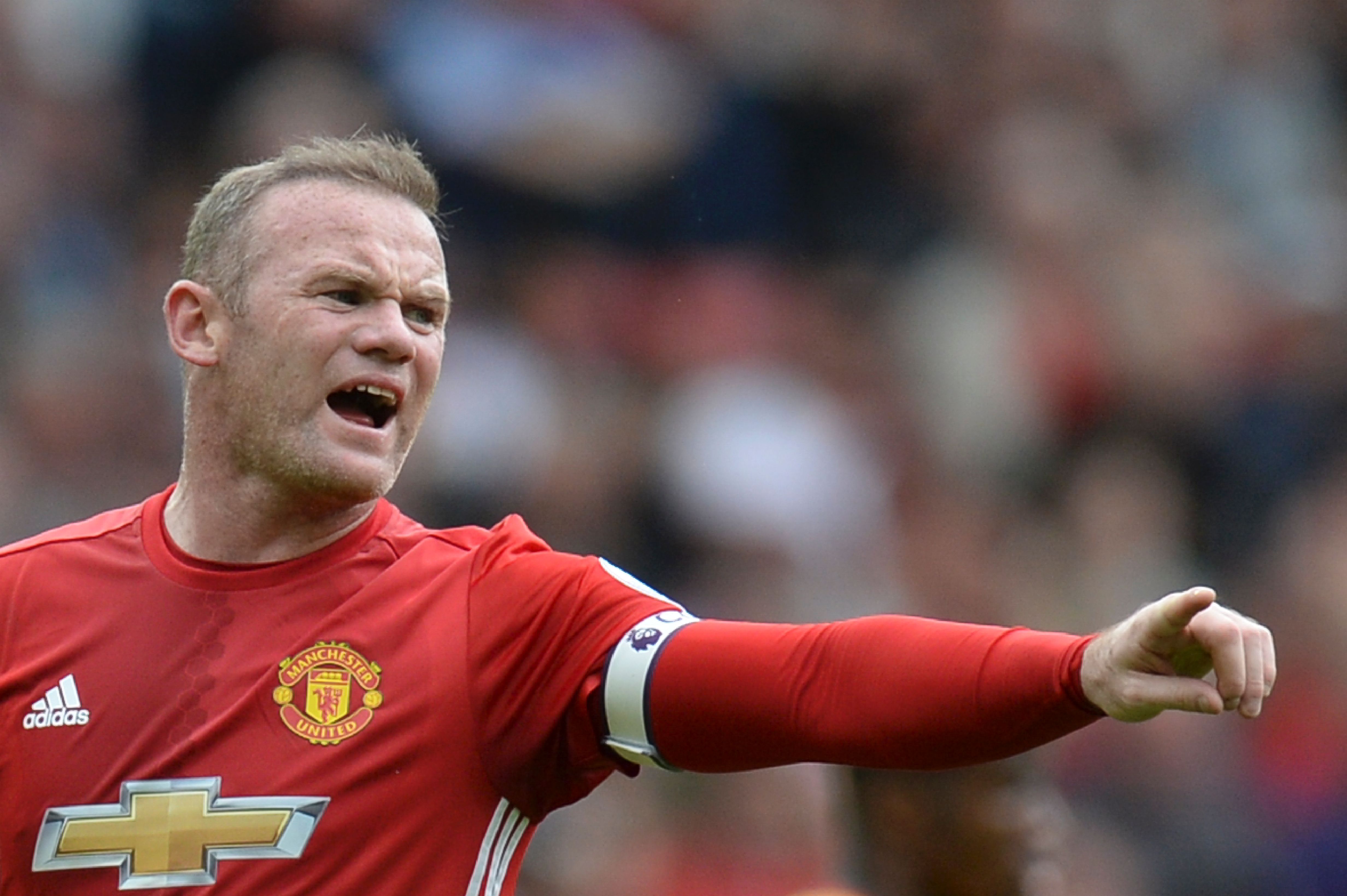 Manchester United's English striker Wayne Rooney shouts instructions during the English Premier League football match between Manchester United and Cyrstal Palace at Old Trafford in Manchester, north west England, on May 21, 2017. / AFP PHOTO / Oli SCARFF / RESTRICTED TO EDITORIAL USE. No use with unauthorized audio, video, data, fixture lists, club/league logos or 'live' services. Online in-match use limited to 75 images, no video emulation. No use in betting, games or single club/league/player publications.  /         (Photo credit should read OLI SCARFF/AFP/Getty Images)