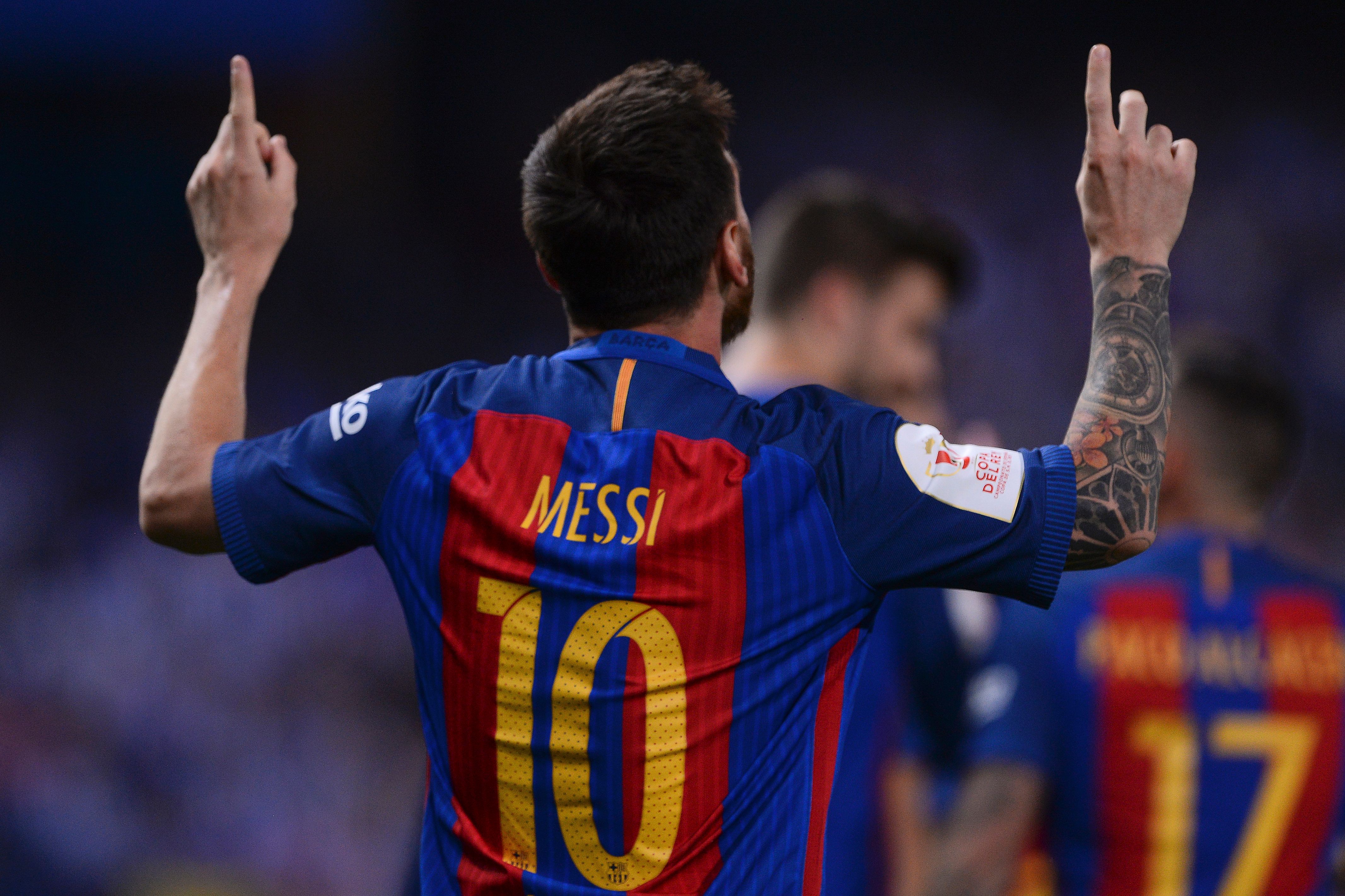 Barcelona's Argentinian forward Lionel Messi celebrates after scoring during the Spanish Copa del Rey (King's Cup) final football match FC Barcelona vs Deportivo Alaves at the Vicente Calderon stadium in Madrid on May 27, 2017. / AFP PHOTO / Josep LAGO        (Photo credit should read JOSEP LAGO/AFP/Getty Images)