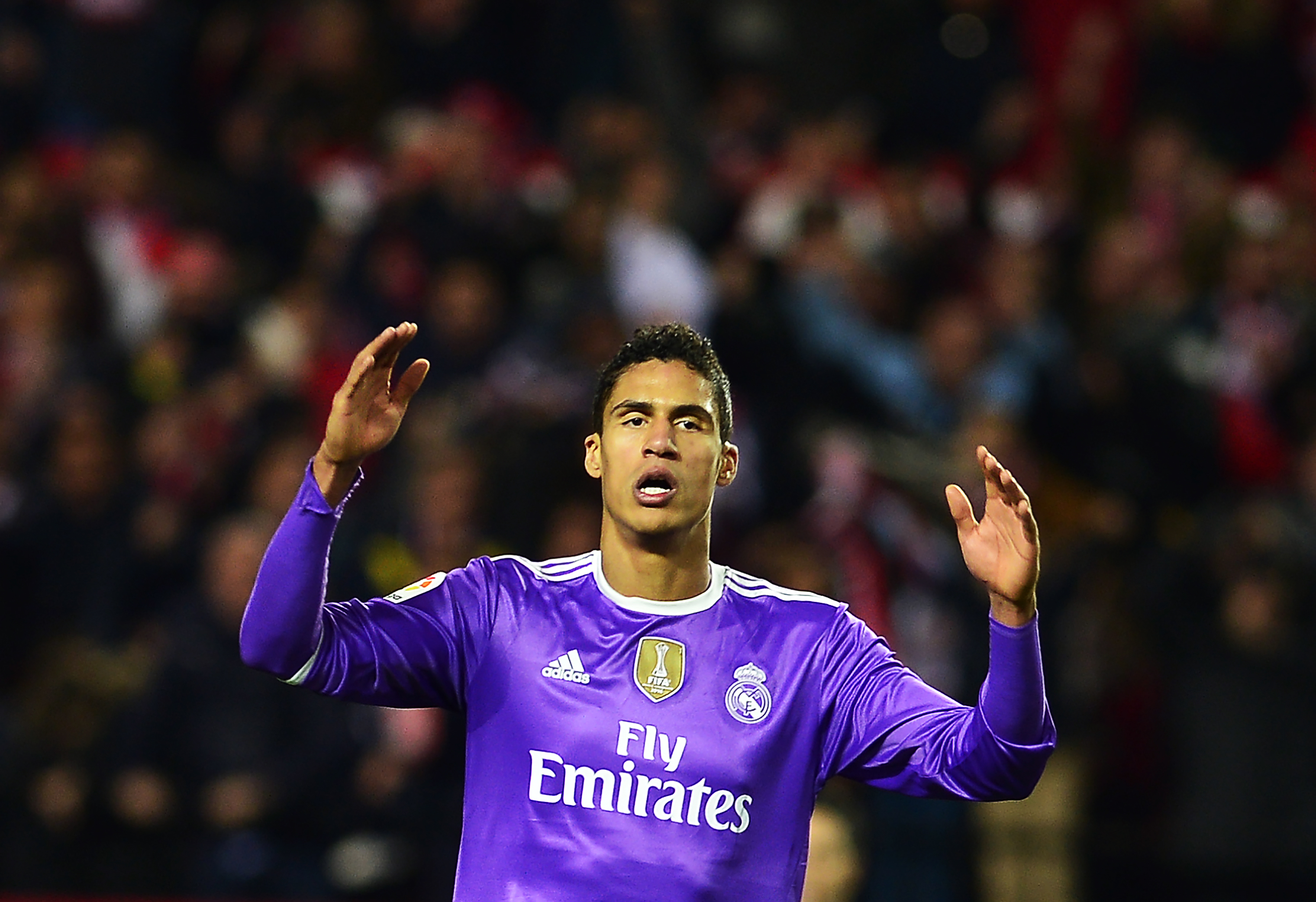 Real Madrid's French defender Raphael Varane gestures during the Spanish league football match Sevilla FC vs Real Madrid CF at the Ramon Sanchez Pizjuan stadium in Sevilla on January 15, 2017.
Sevilla won 2-1. / AFP / CRISTINA QUICLER        (Photo credit should read CRISTINA QUICLER/AFP/Getty Images)