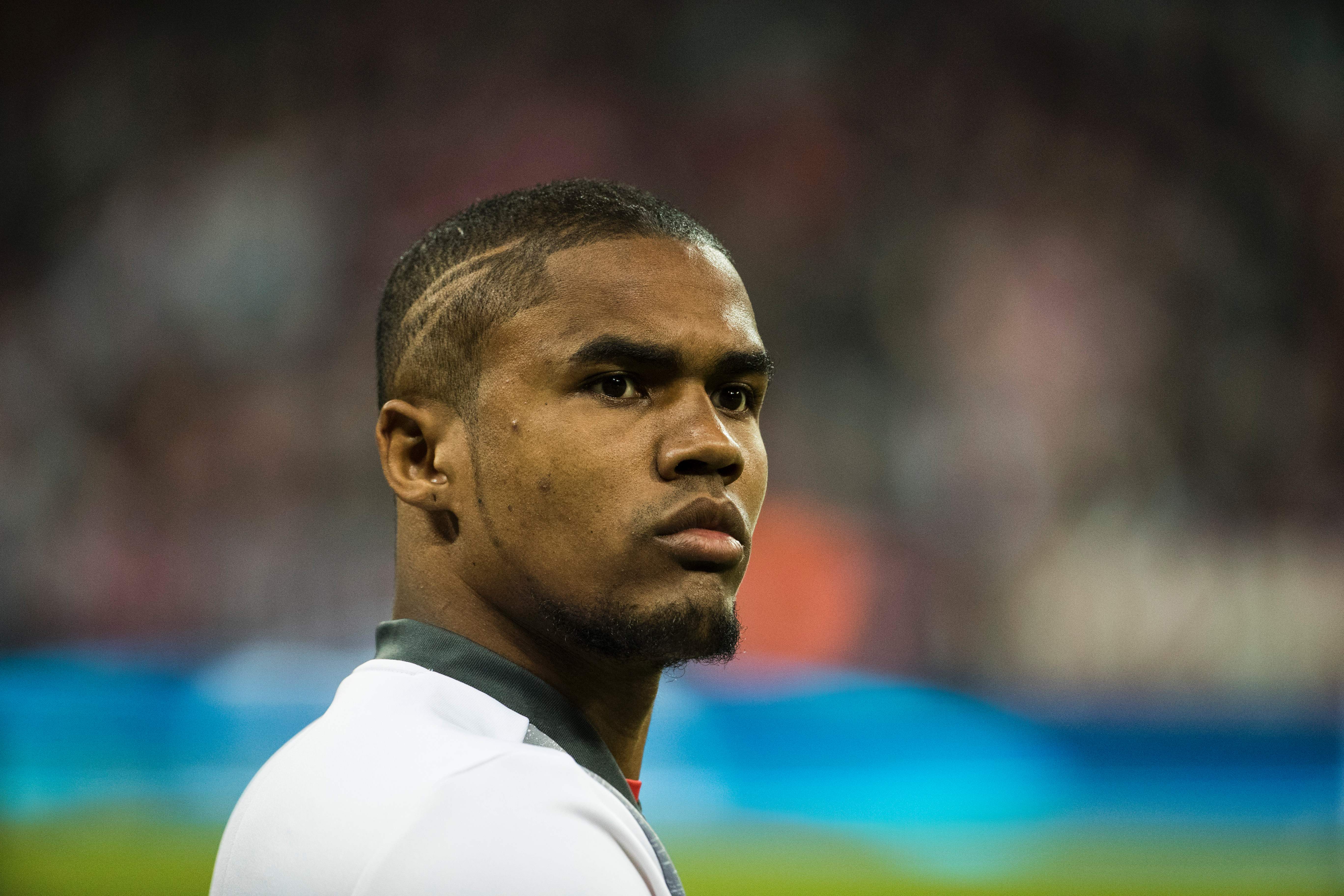 Bayern Munich's Brazilian forward Douglas Costa is seen during warm up prior to the UEFA Champions League 1st leg quarter-final football match FC Bayern Munich v Real Madrid in Munich, southen Germany on April 12, 2017. / AFP PHOTO / Odd ANDERSEN        (Photo credit should read ODD ANDERSEN/AFP/Getty Images)
