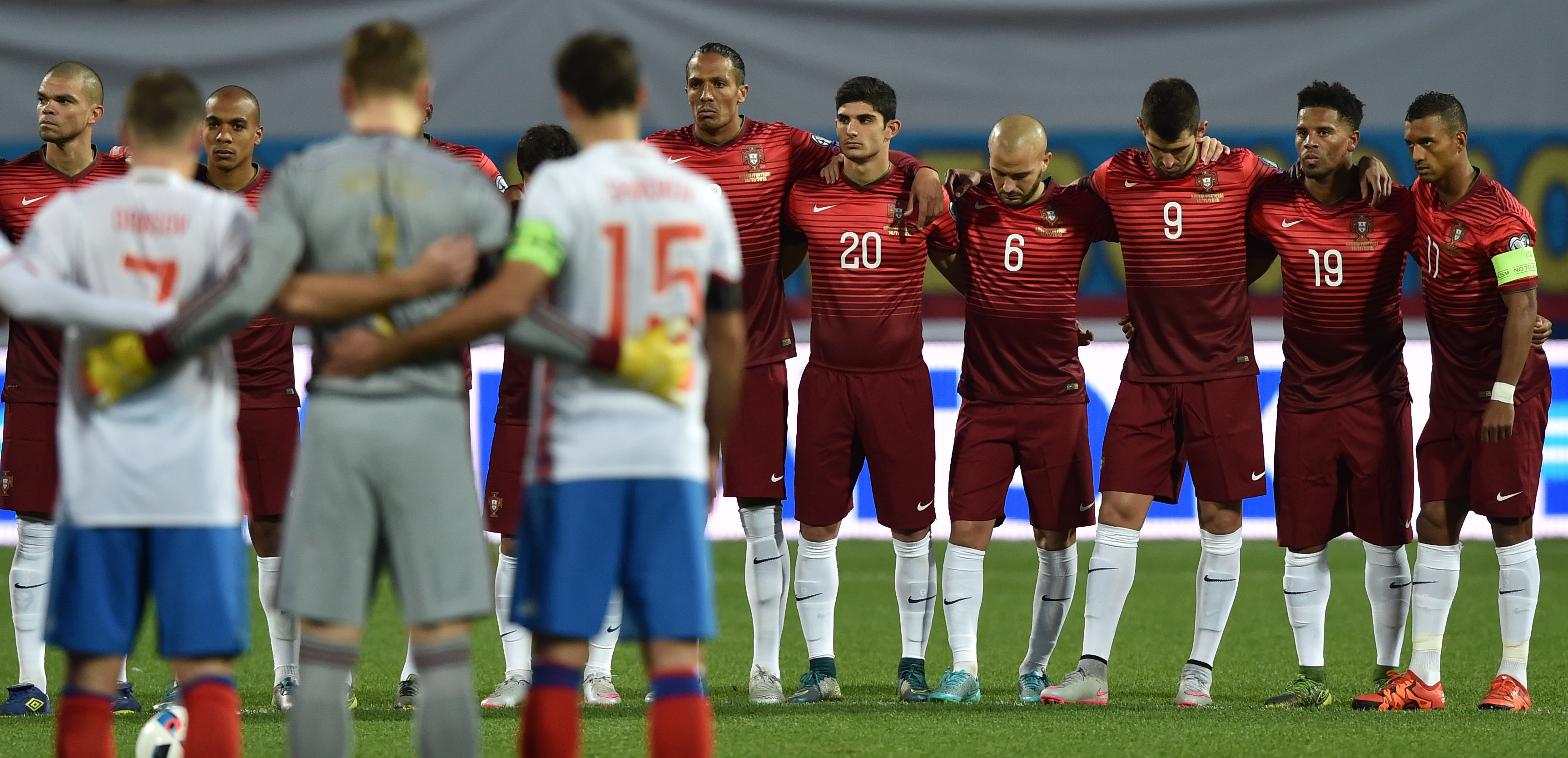 Russia's and Portugal's players observe a minute of silence in honor of victims of the attacks that left at least 120 dead in Paris, prior to the friendly football match between Russia and Portugal in Krasnodar on November 14, 2015. AFP PHOTO / KIRILL KUDRYAVTSEV        (Photo credit should read KIRILL KUDRYAVTSEV/AFP/Getty Images)