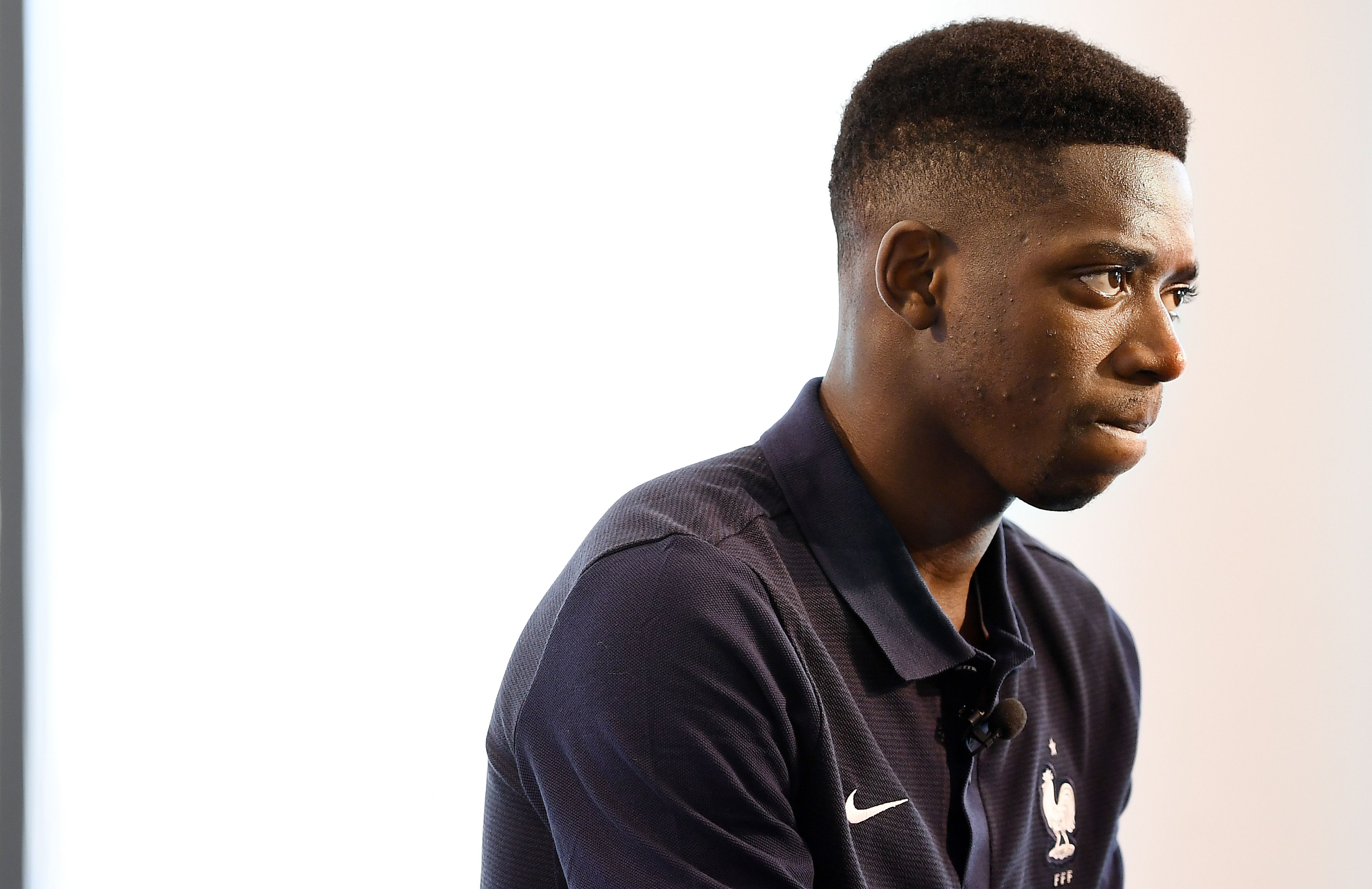 France's forward Ousmane Dembele reacts during a press conference in Clairefontaine en Yvelines on June 5, 2017 as part of the team preparation for the upcoming World Cup 2018 qualifier football match against Sweden on June 9.  / AFP PHOTO / FRANCK FIFE        (Photo credit should read FRANCK FIFE/AFP/Getty Images)