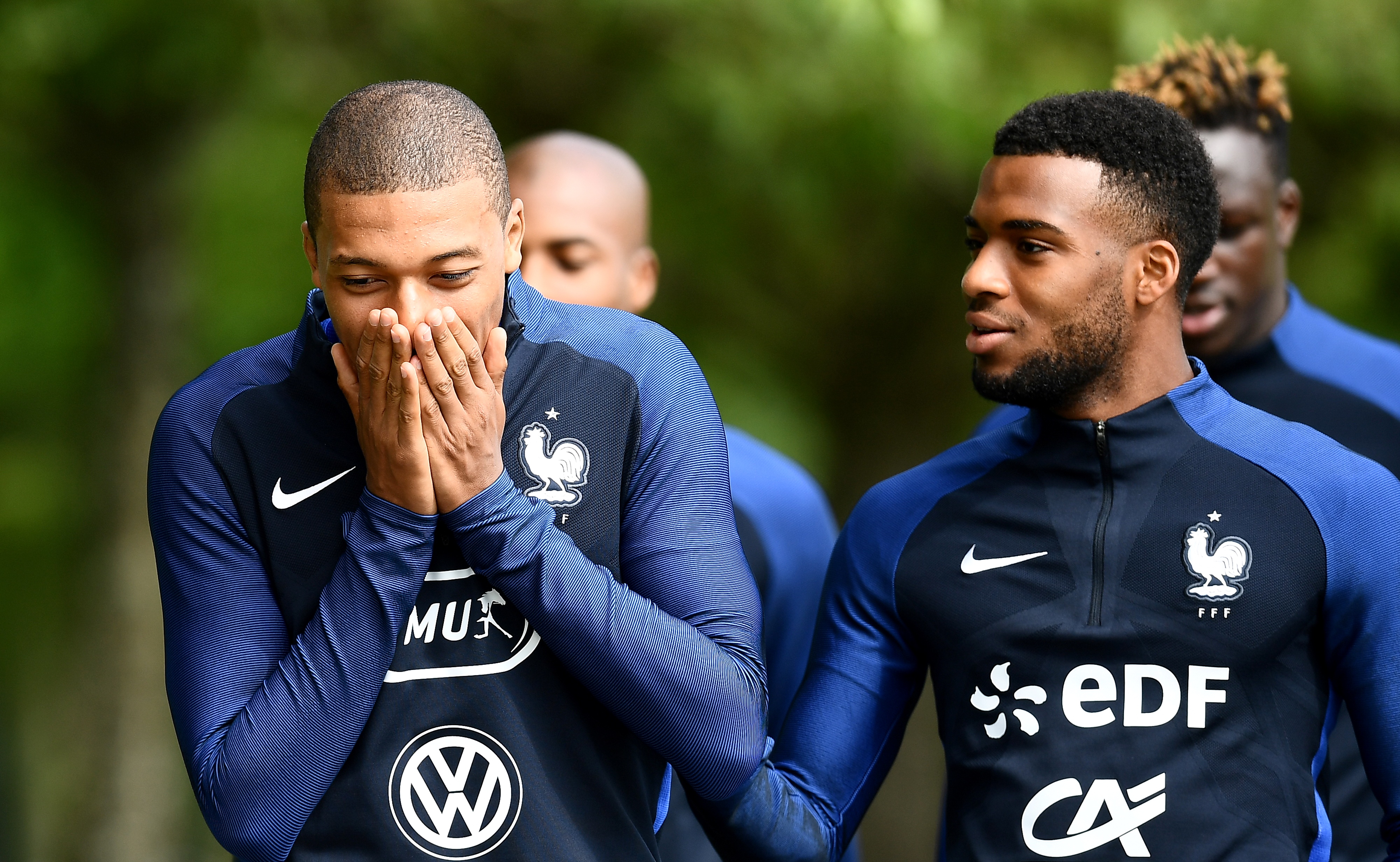 France's forward Kylian Mbappe jokes with France's forward Thomas Lemar (R) before a training session in Clairefontaine-en-Yvelines on May 30, 2017.
Team France prepares for the friendly football match against Paraguay to be held on June 2 and World Cup qualifier against Sweden on June 9. / AFP PHOTO / FRANCK FIFE        (Photo credit should read FRANCK FIFE/AFP/Getty Images)