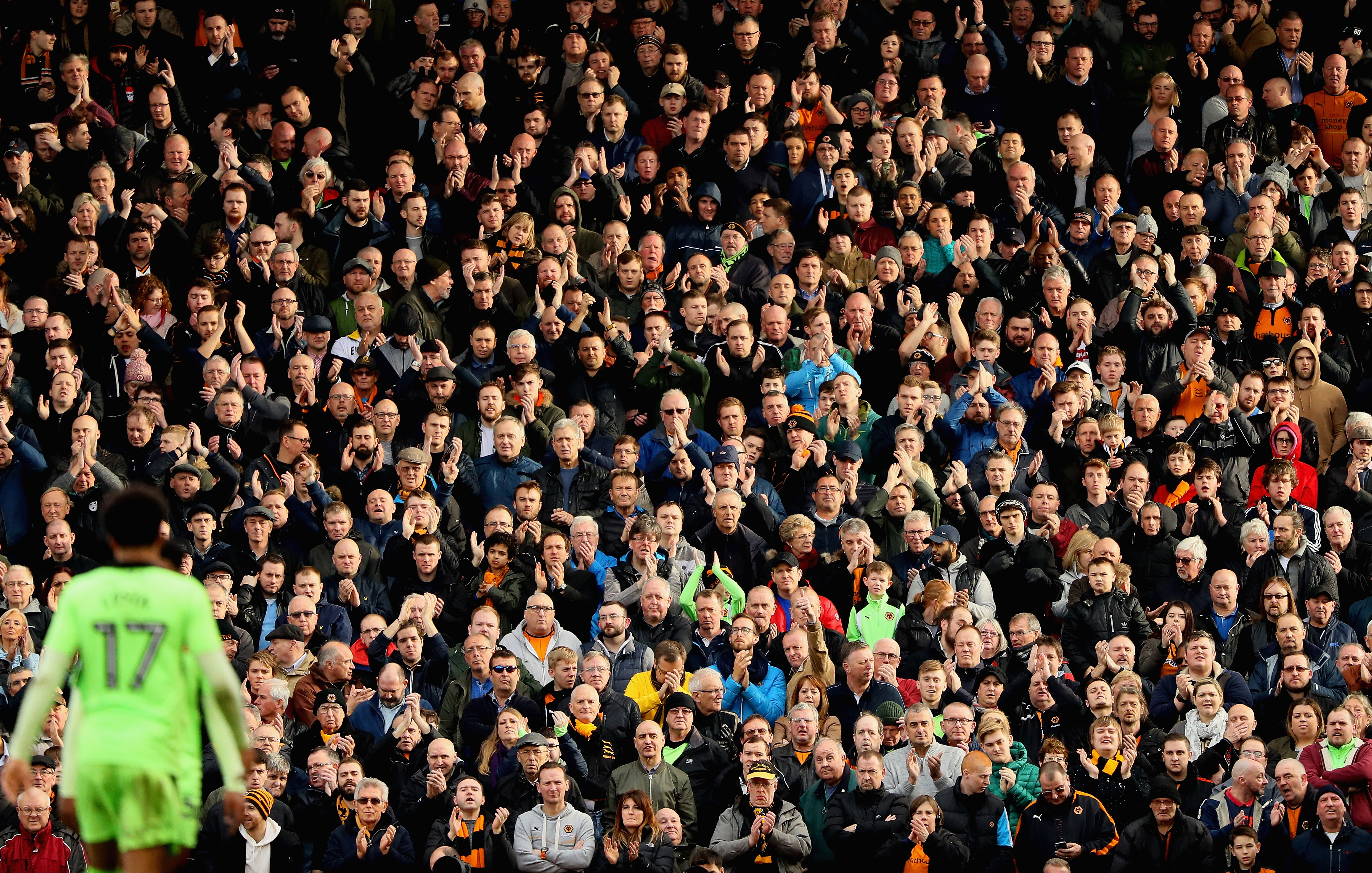 LONDON, ENGLAND - MARCH 18:  A general view of spectators in a packed grandstand watching Hélder Costa of Wolverhampton Wanderers (bottom left) during the Sky Bet Championship match between Fulham and Wolverhampton Wanderers at Craven Cottage on March 18, 2017 in London, England.  (Photo by Andrew Redington/Getty Images)