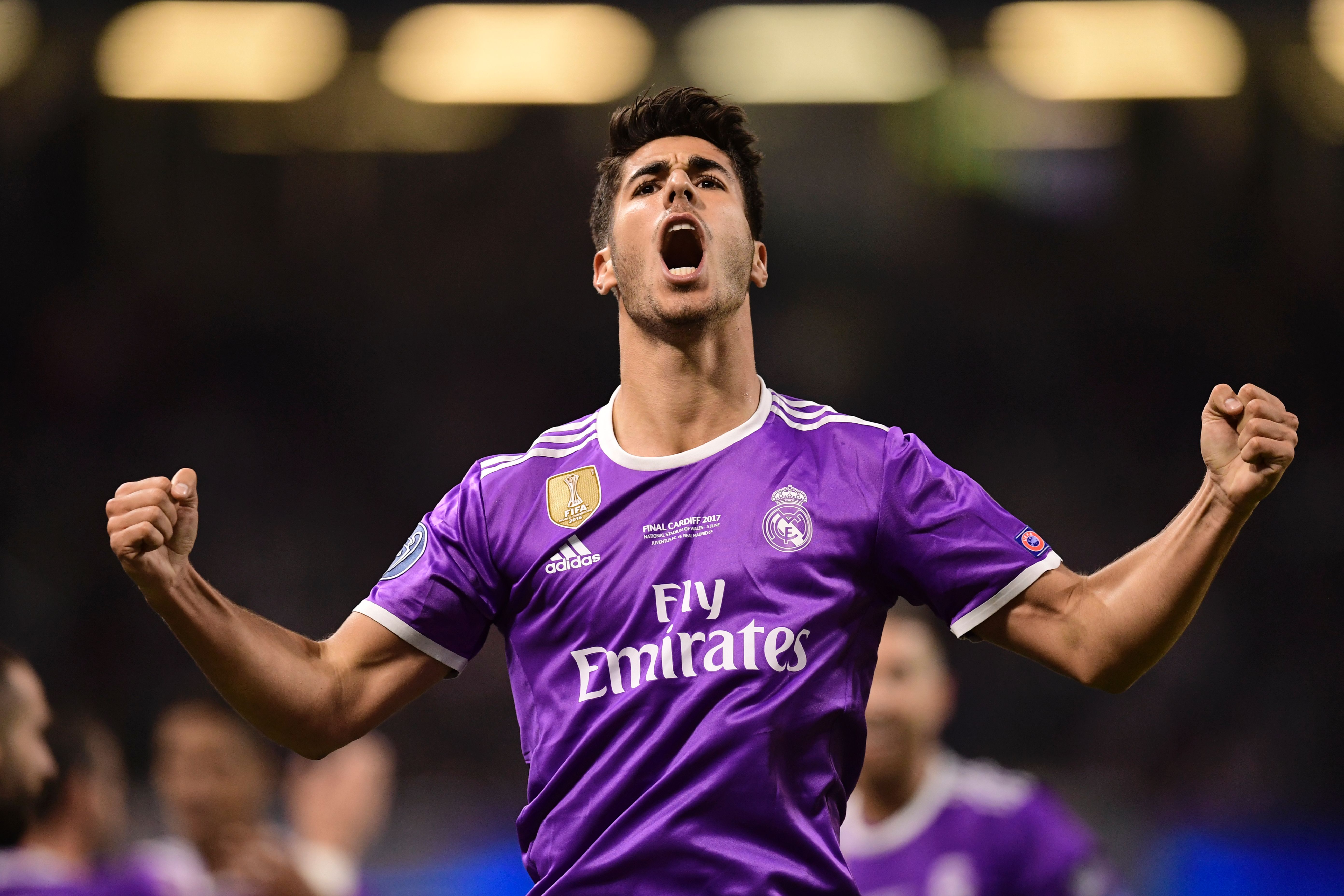 TOPSHOT - Real Madrid's Spanish midfielder Marco Asensio celebrates after scoring their fourth goal during the UEFA Champions League final football match between Juventus and Real Madrid at The Principality Stadium in Cardiff, south Wales, on June 3, 2017. / AFP PHOTO / JAVIER SORIANO        (Photo credit should read JAVIER SORIANO/AFP/Getty Images)