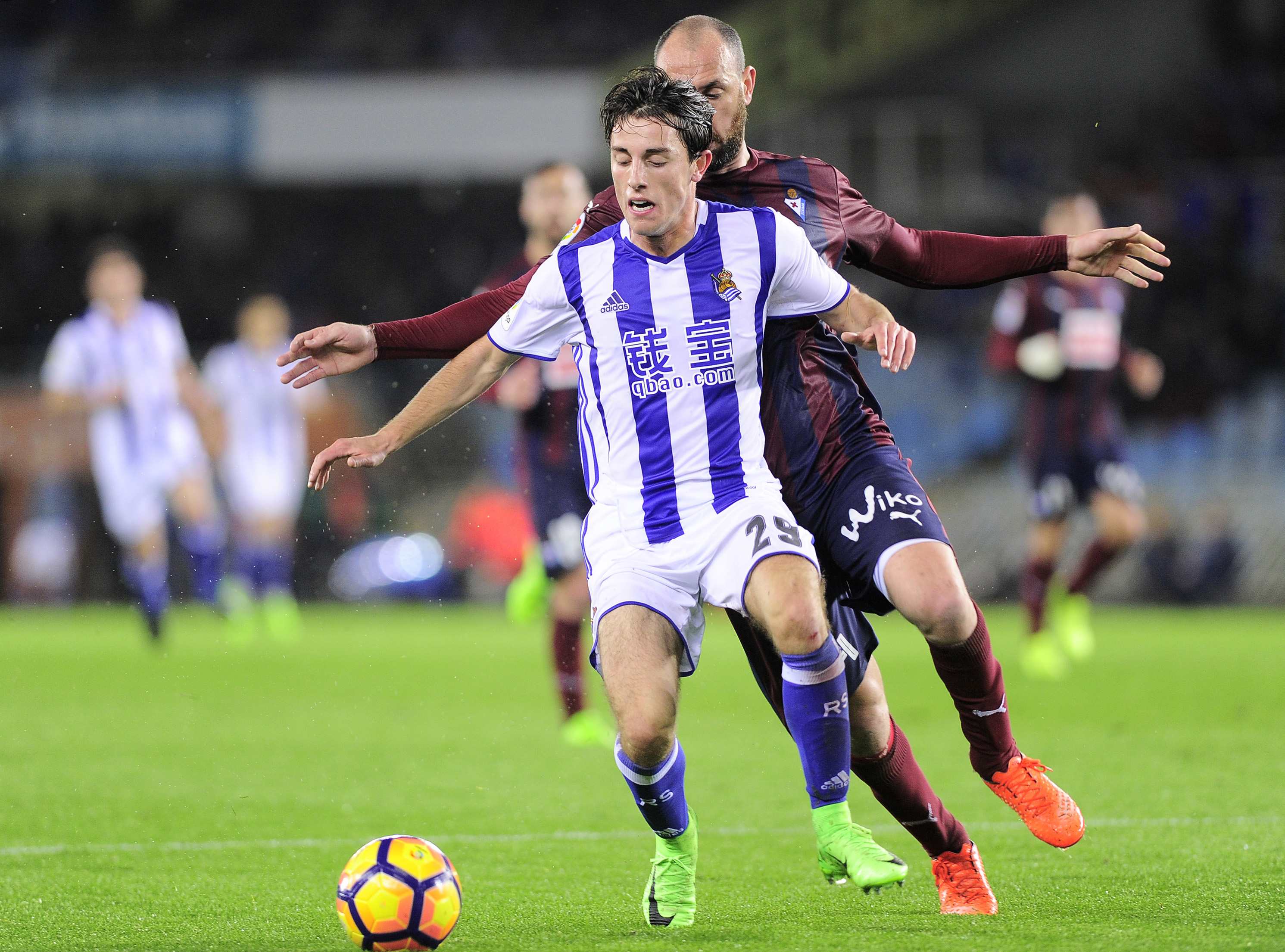 CORRECTION - Real Sociedad's defender Alvaro Odriozola (L) vies with Eibar's defender Ivan Ramis (R) during the Spanish league football match Real Sociedad vs SD Eibar at the Anoeta stadium in San Sebastian on February 28, 2017. / AFP / ANDER GILLENEA / The erroneous mention[s] appearing in the metadata of this photo M64GD by ANDER GILLENEA has been modified in AFP systems in the following manner: [Real Sociedad's defender Alvaro Odriozola] instead of [Real Sociedad's forward Igor Zubeldia]. Please immediately remove the erroneous mention[s] from all your online services and delete it (them) from your servers. If you have been authorized by AFP to distribute it (them) to third parties, please ensure that the same actions are carried out by them. Failure to promptly comply with these instructions will entail liability on your part for any continued or post notification usage. Therefore we thank you very much for all your attention and prompt action. We are sorry for the inconvenience this notification may cause and remain at your disposal for any further information you may require.        (Photo credit should read ANDER GILLENEA/AFP/Getty Images)