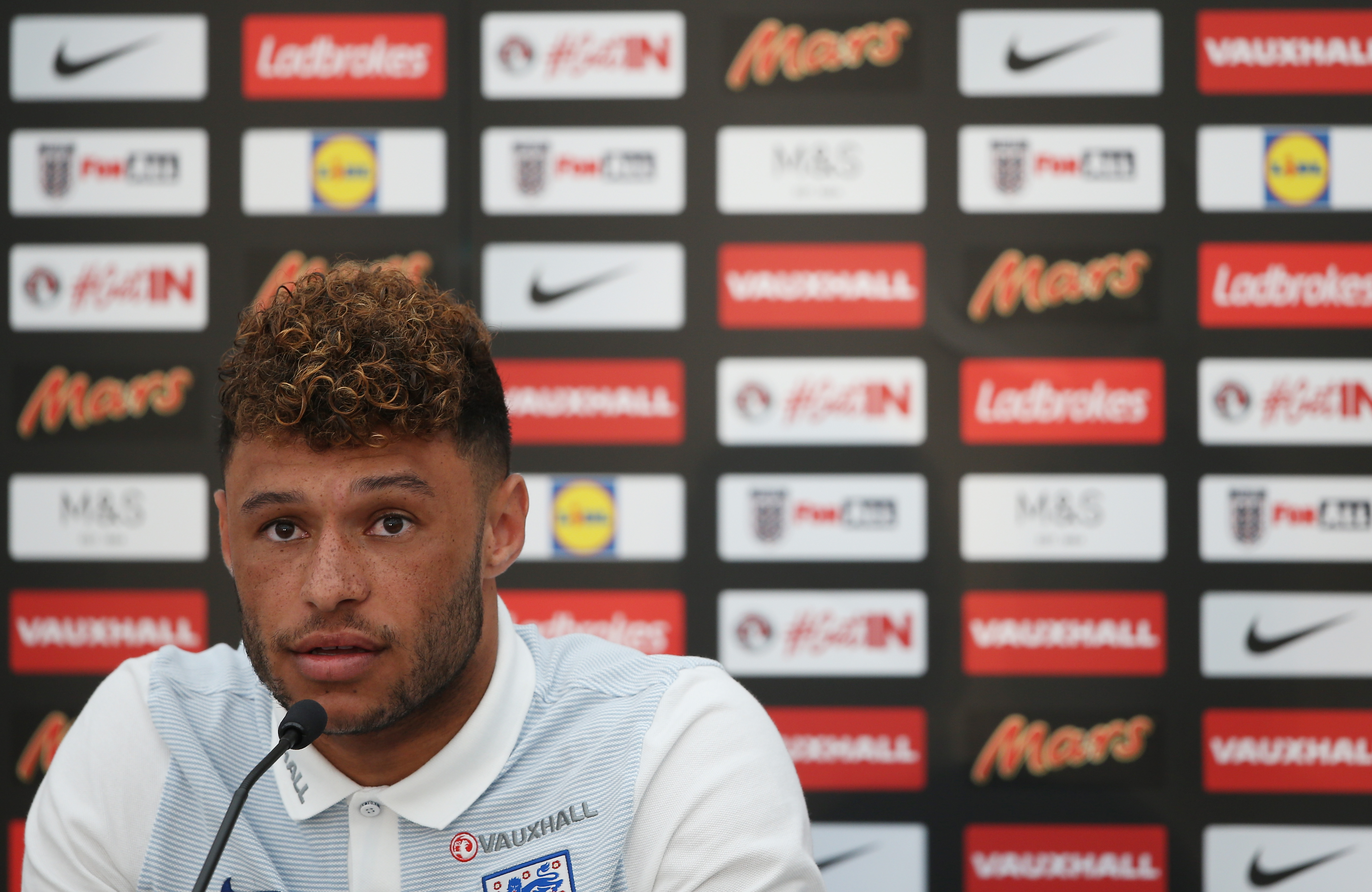 CROISSY-SUR-SEINE, FRANCE - JUNE 12:  Alex Oxlade-Chamberlain speaks to the media during the England press conference at the Chemin De Ronde Stadium on June 12, 2017 in Croissy-sur-Seine, France.  (Photo by Alex Pantling/Getty Images)