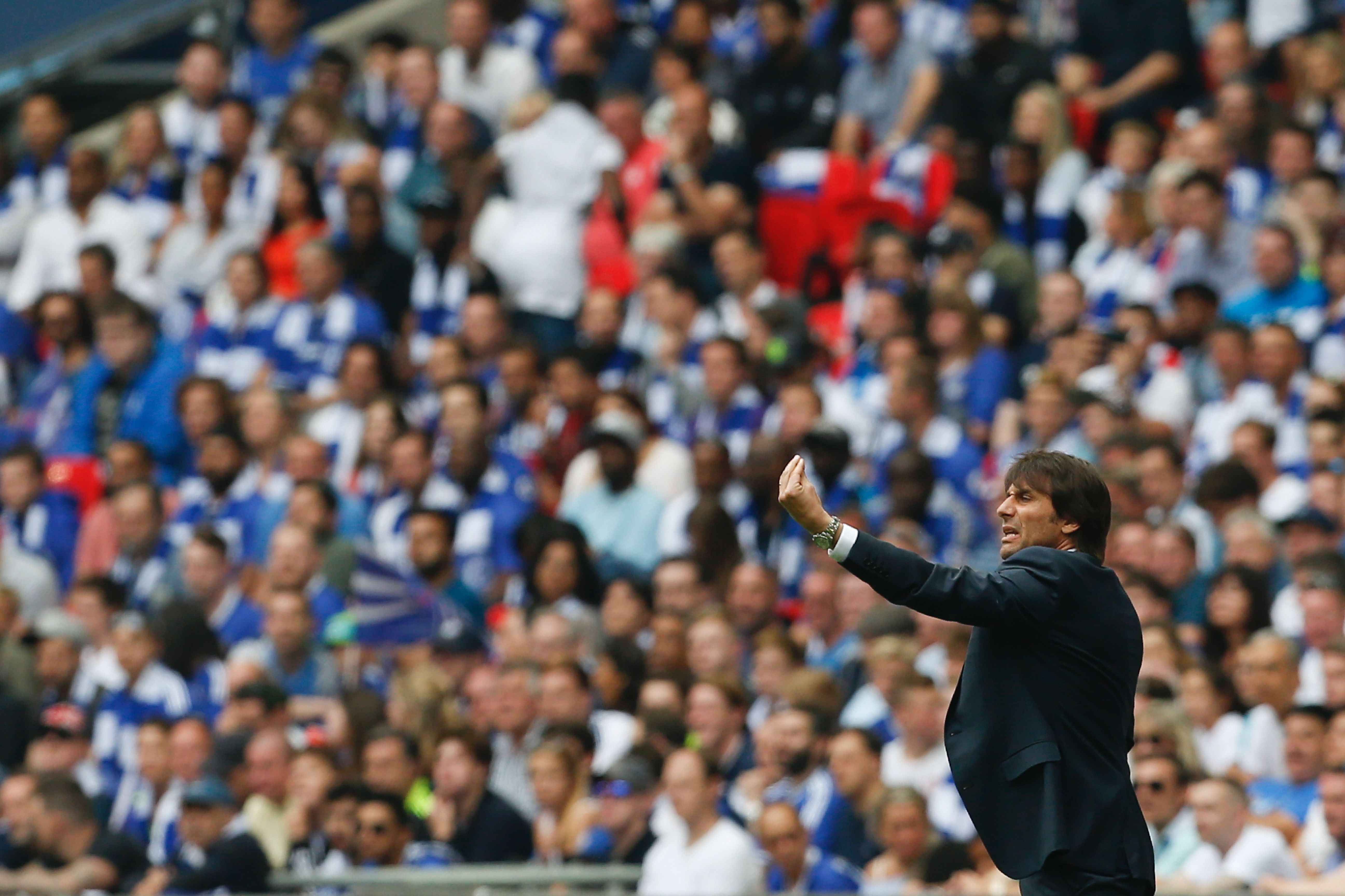Chelsea's Italian head coach Antonio Conte gestures on the touchline during the English FA Cup final football match between Arsenal and Chelsea at Wembley stadium in London on May 27, 2017. / AFP PHOTO / Ian KINGTON / NOT FOR MARKETING OR ADVERTISING USE / RESTRICTED TO EDITORIAL USE        (Photo credit should read IAN KINGTON/AFP/Getty Images)