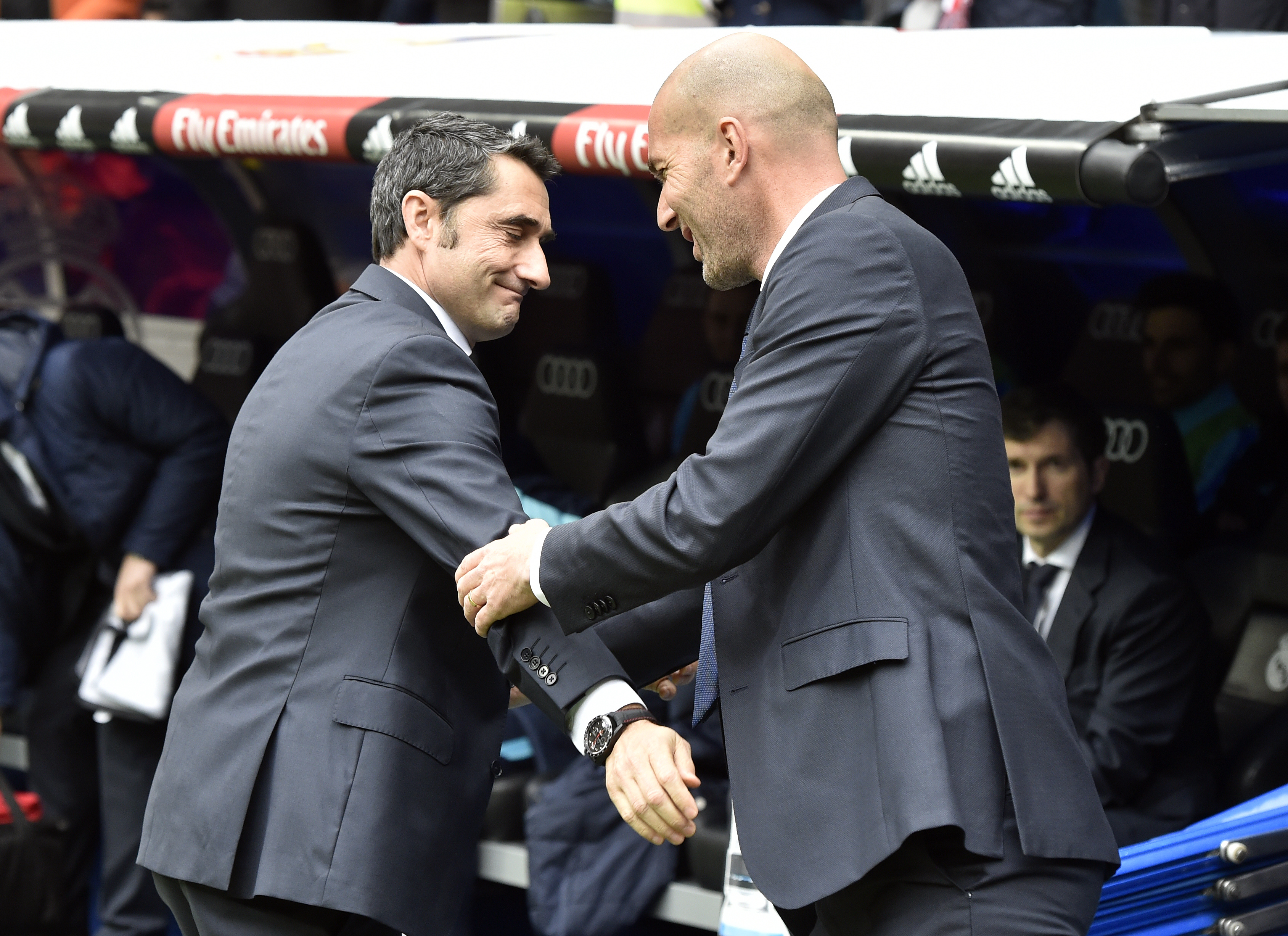 Athletic Bilbao's coach Ernesto Valverde (L) greets Real Madrid's French coach Zinedine Zidane before the Spanish league football match Real Madrid CF vs Athletic Club Bilbao at the Santiago Bernabeu stadium in Madrid on February 13, 2016. / AFP / GERARD JULIEN        (Photo credit should read GERARD JULIEN/AFP/Getty Images)