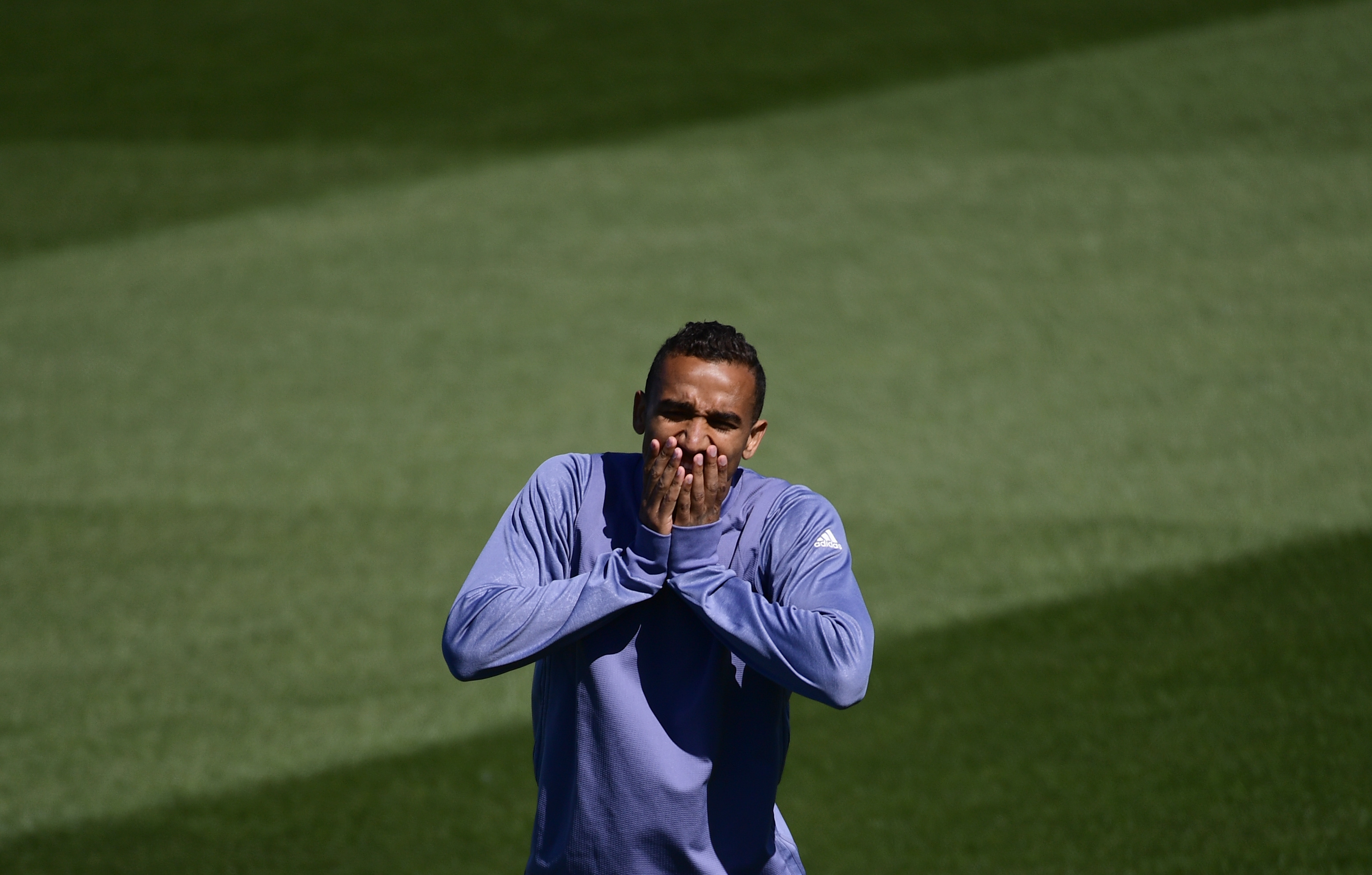 Real Madrid's Brazilian defender Danilo gestures during a training session at Valdebebas Sport City in Madrid on May 1, 2017 on the eve of their Champions' League semi-final first leg football match against Atletico de Madrid. / AFP PHOTO / PIERRE-PHILIPPE MARCOU        (Photo credit should read PIERRE-PHILIPPE MARCOU/AFP/Getty Images)