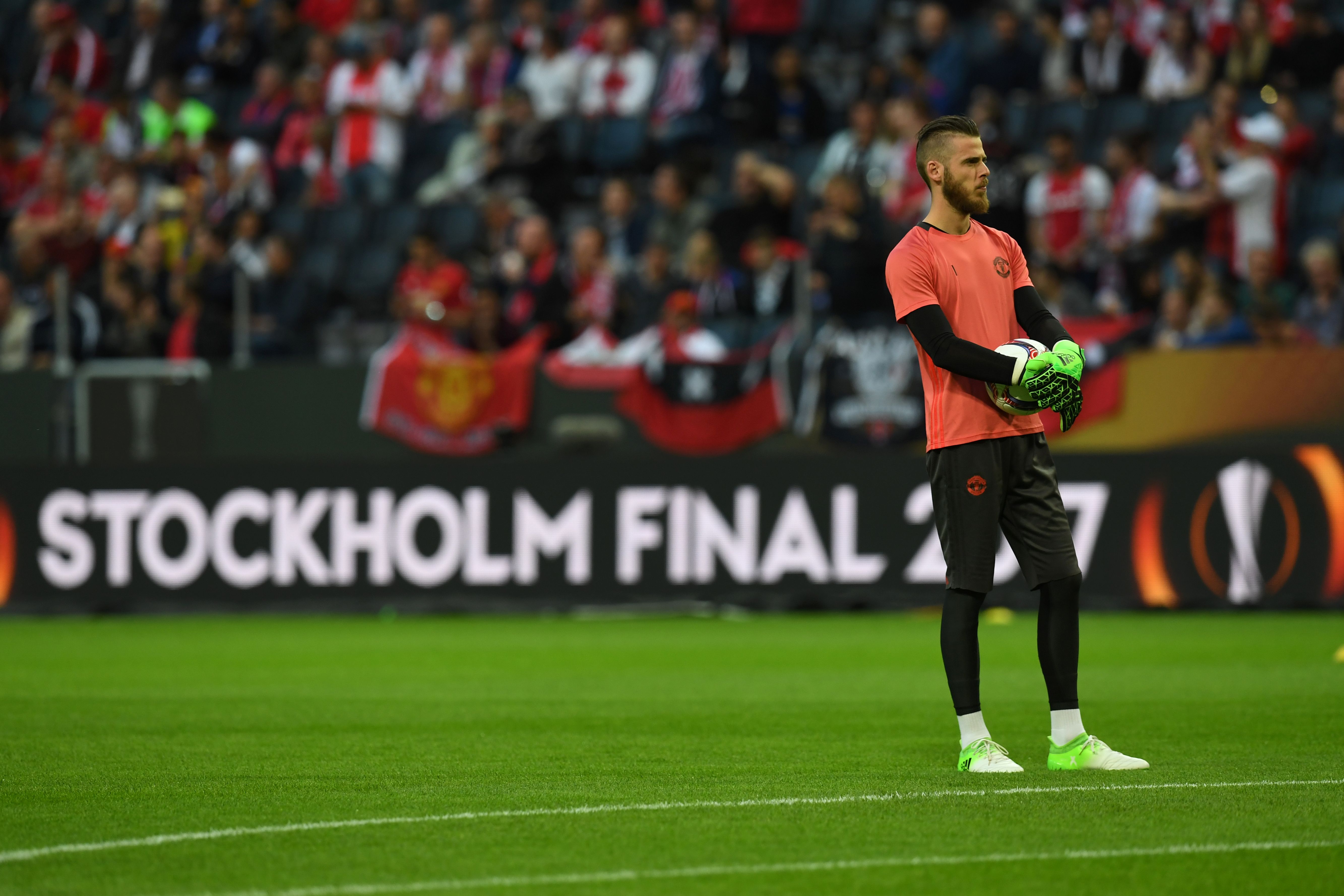 Manchester United's Spanish goalkeeper David de Gea Holds the ball during warm up prior to the UEFA Europa League final football match Ajax Amsterdam v Manchester United on May 24, 2017 at the Friends Arena in Solna outside Stockholm. / AFP PHOTO / Paul ELLIS        (Photo credit should read PAUL ELLIS/AFP/Getty Images)