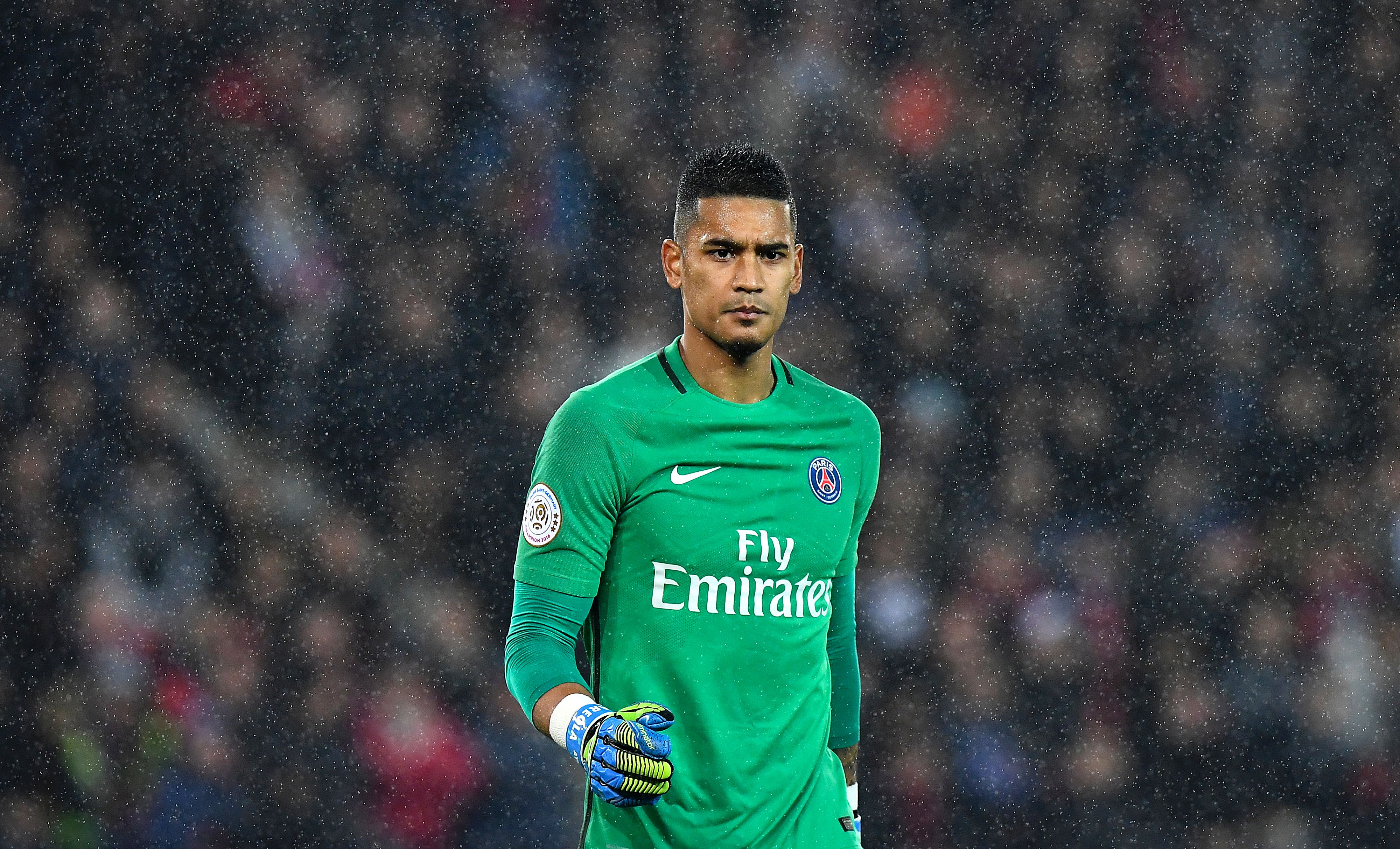 Paris Saint-Germain's French goalkeeper Alphonse Areola walks in the rain during the French L1 football match between Paris Saint-Germain and Olympique of Marseille at the Parc des Princes stadium in Paris on October 23, 2016. / AFP / FRANCK FIFE        (Photo credit should read FRANCK FIFE/AFP/Getty Images)