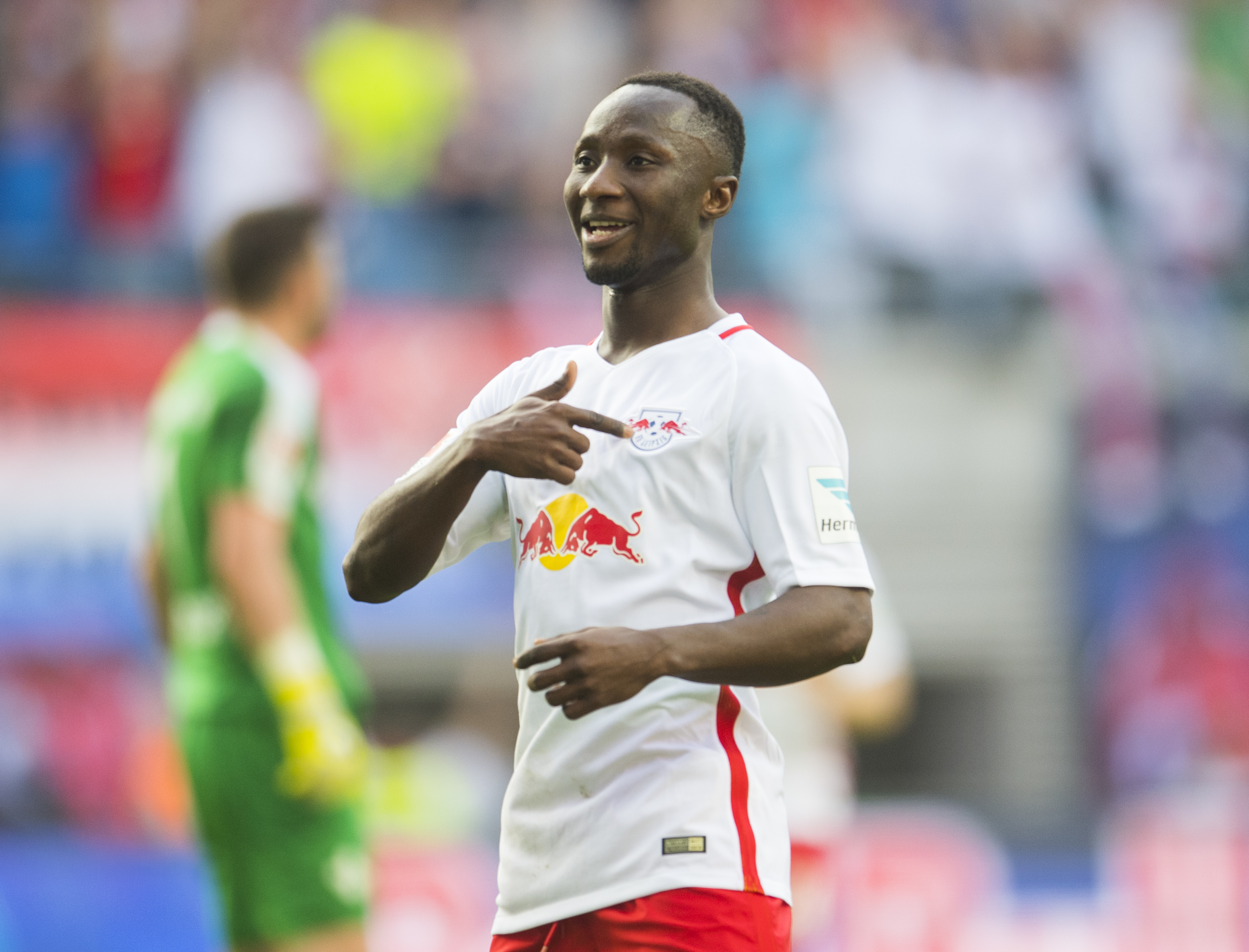 Leipzig's Guinean midfielder Naby Keita celebrates after scoring the 4-0 during the German first division Bundesliga football match between RB Leipzig and SV Darmstadt 98 in Leipzig, eastern Germany, on April 1, 2017. / AFP PHOTO / ROBERT MICHAEL / RESTRICTIONS: DURING MATCH TIME: DFL RULES TO LIMIT THE ONLINE USAGE TO 15 PICTURES PER MATCH AND FORBID IMAGE SEQUENCES TO SIMULATE VIDEO. == RESTRICTED TO EDITORIAL USE == FOR FURTHER QUERIES PLEASE CONTACT DFL DIRECTLY AT + 49 69 650050
        (Photo credit should read ROBERT MICHAEL/AFP/Getty Images)