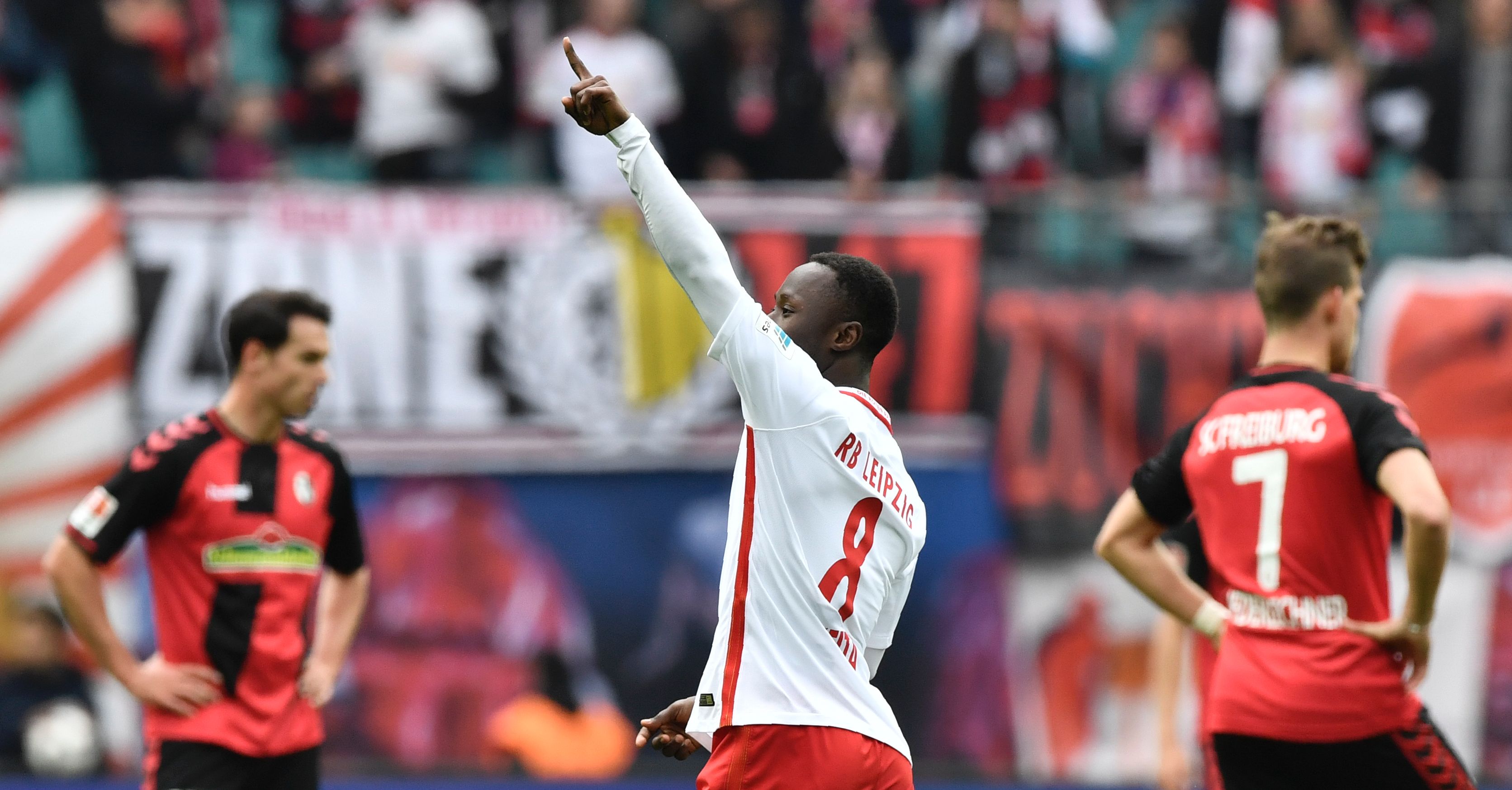 Leipzig's Guinean midfielder Naby Keita celebrates after scoring the third goal during the Bundesliga match RB Leipzig vs SC Freiburg in Leipzig on April 15, 2017. 
Leipzig won 4 to 0, earning themselves a spot in next season's champions league. / AFP PHOTO / John MACDOUGALL / RESTRICTIONS: DURING MATCH TIME: DFL RULES TO LIMIT THE ONLINE USAGE TO 15 PICTURES PER MATCH AND FORBID IMAGE SEQUENCES TO SIMULATE VIDEO. == RESTRICTED TO EDITORIAL USE == FOR FURTHER QUERIES PLEASE CONTACT DFL DIRECTLY AT + 49 69 650050
        (Photo credit should read JOHN MACDOUGALL/AFP/Getty Images)