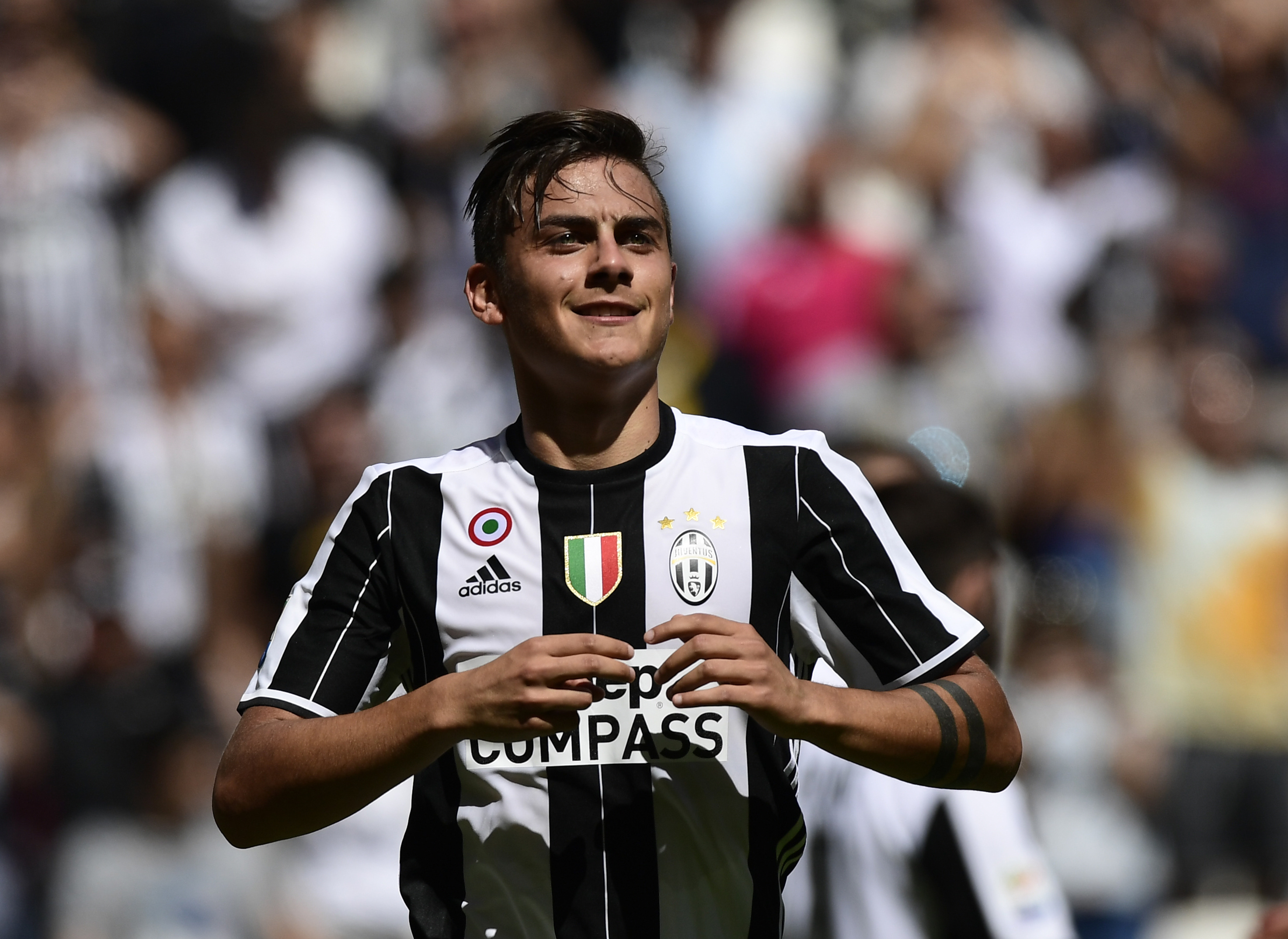 Juventus' Argentinian forward Paulo Dybala celebrates after scoring during the Italian Serie A football match Juventus vs Crotone at the Juventus Stadium in Turin on May 21, 2017.  / AFP PHOTO / MIGUEL MEDINA        (Photo credit should read MIGUEL MEDINA/AFP/Getty Images)