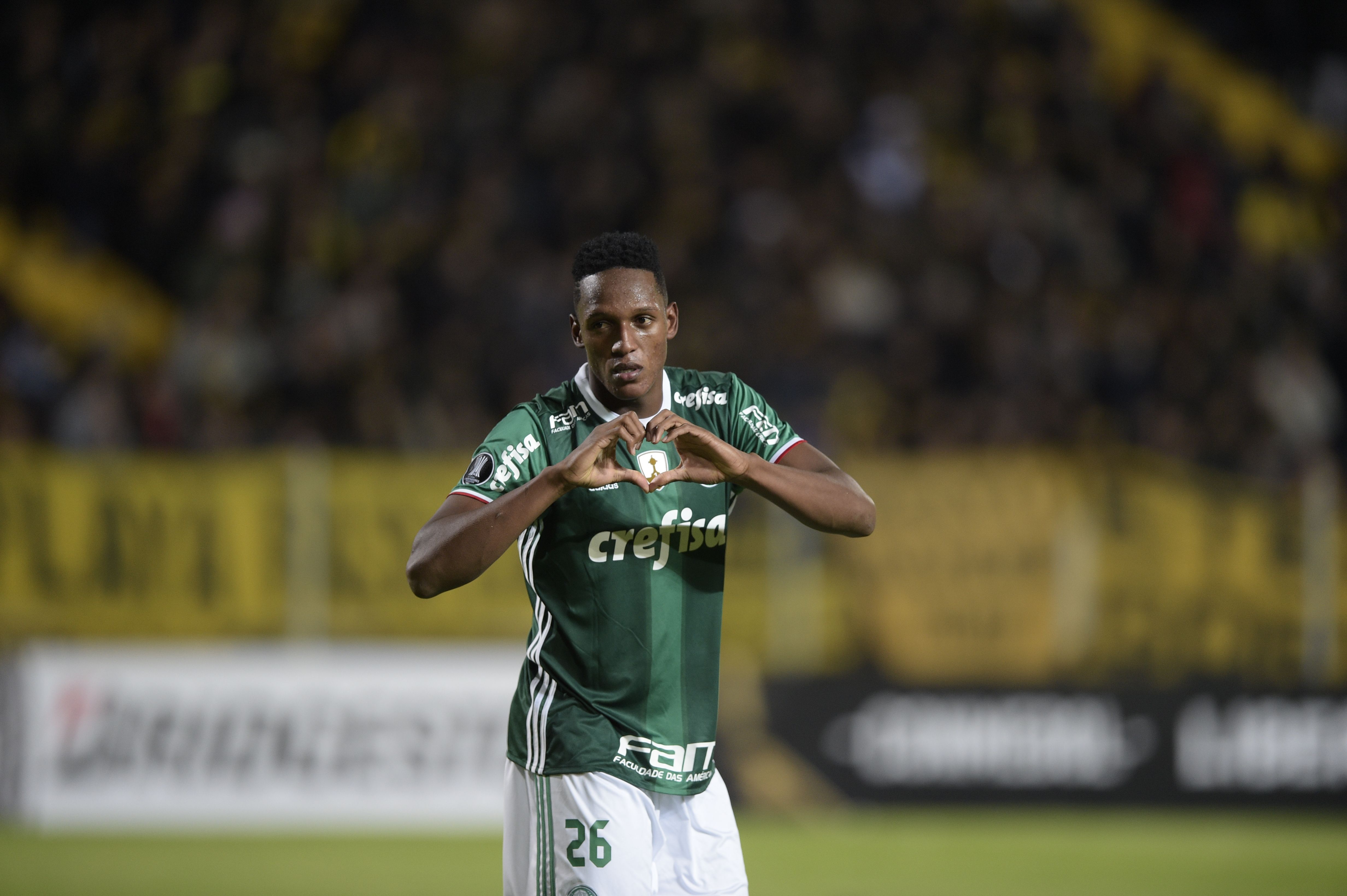 Brazil's Palmeiras player Yerry Mina celebrates after scoring a goal against Uruguay's Penarol during their Libertadores Cup football match at the Campeones del Siglo Stadium in Montevideo on April 26, 2017.  / AFP PHOTO / MIGUEL ROJO        (Photo credit should read MIGUEL ROJO/AFP/Getty Images)