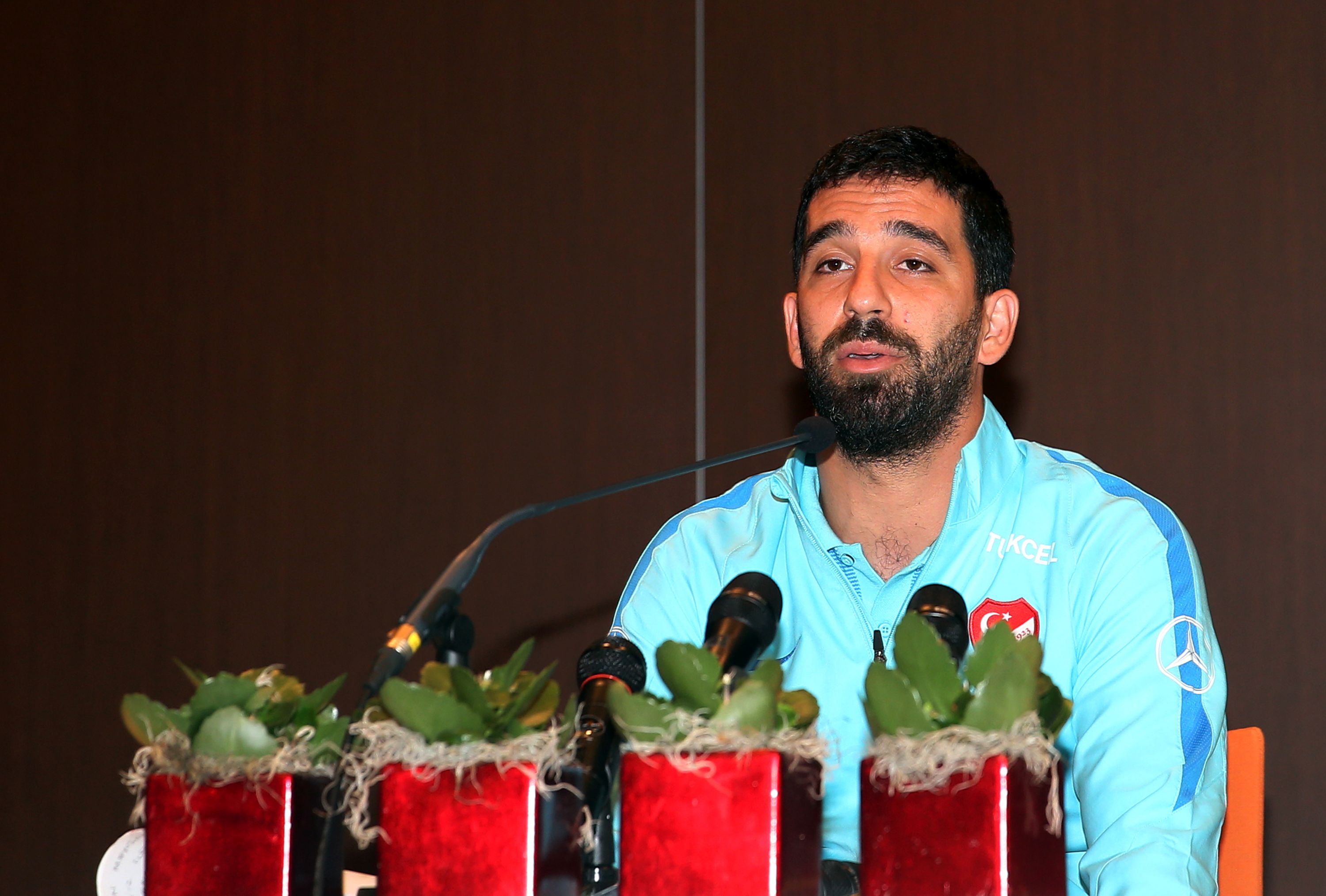 Barcelona's Turkish midfielder and Turkey's captain Arda Turan addresses a press conference announcing his retirement from international football in Portoroz, Slovenia, on June 6, 2017.
Turan announced his retirement from international football on Tuesday, hours after being kicked out of a training camp by coach Fatih Terim for allegedly verbally and physically abusing a journalist. Turan had been told to leave the Turkey team's camp in Slovenia where they are preparing for a 2018 World Cup qualifier against Kosovo on June 11, the daily Hürriyet and news channel NTV earlier reported. / AFP PHOTO / STR        (Photo credit should read STR/AFP/Getty Images)