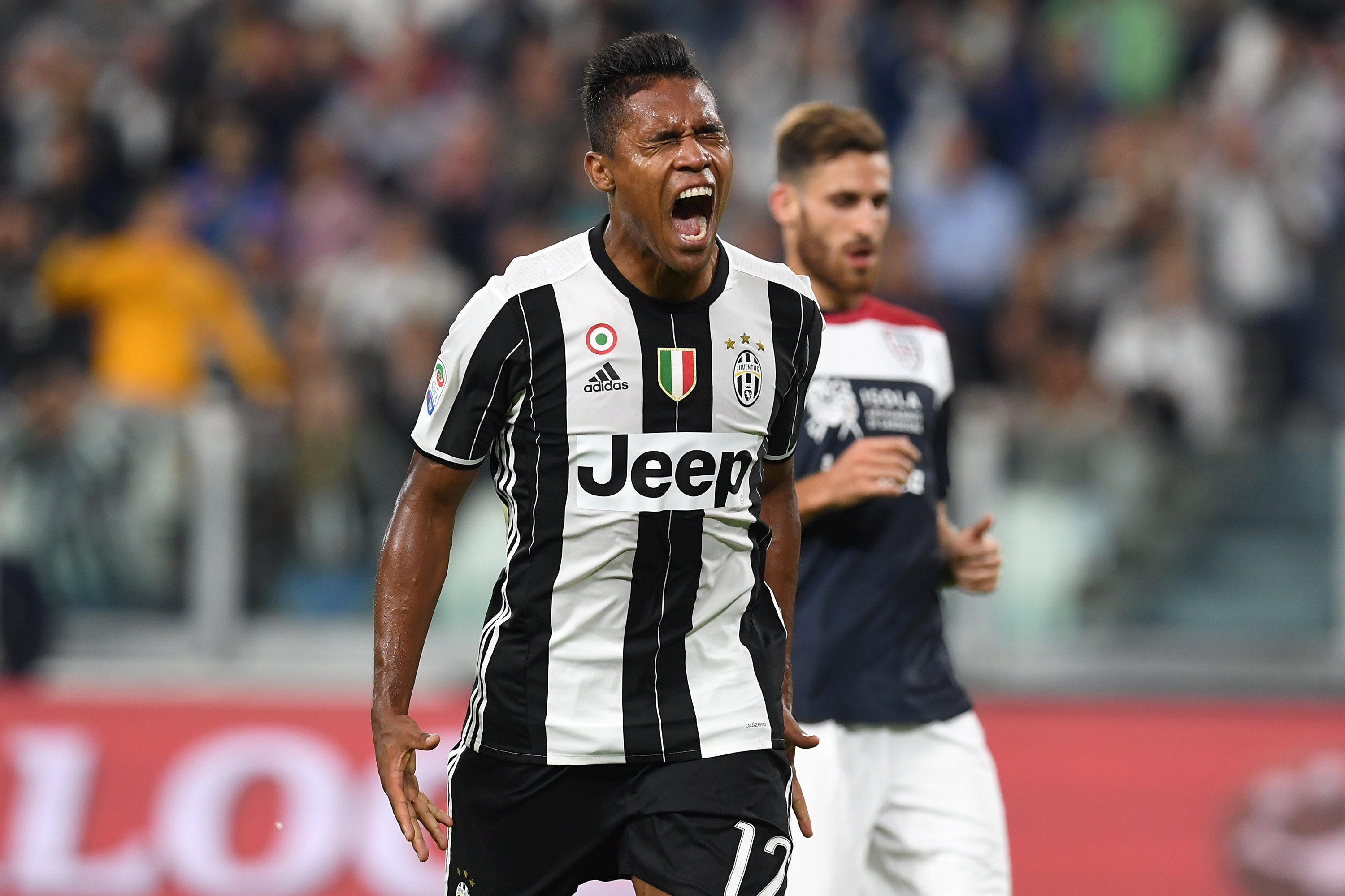 TURIN, ITALY - SEPTEMBER 21:  Alex Sandro of Juventus FC reacts during the Serie A match between Juventus FC and Cagliari Calcio at Juventus Stadium on September 21, 2016 in Turin, Italy.  (Photo by Valerio Pennicino/Getty Images)