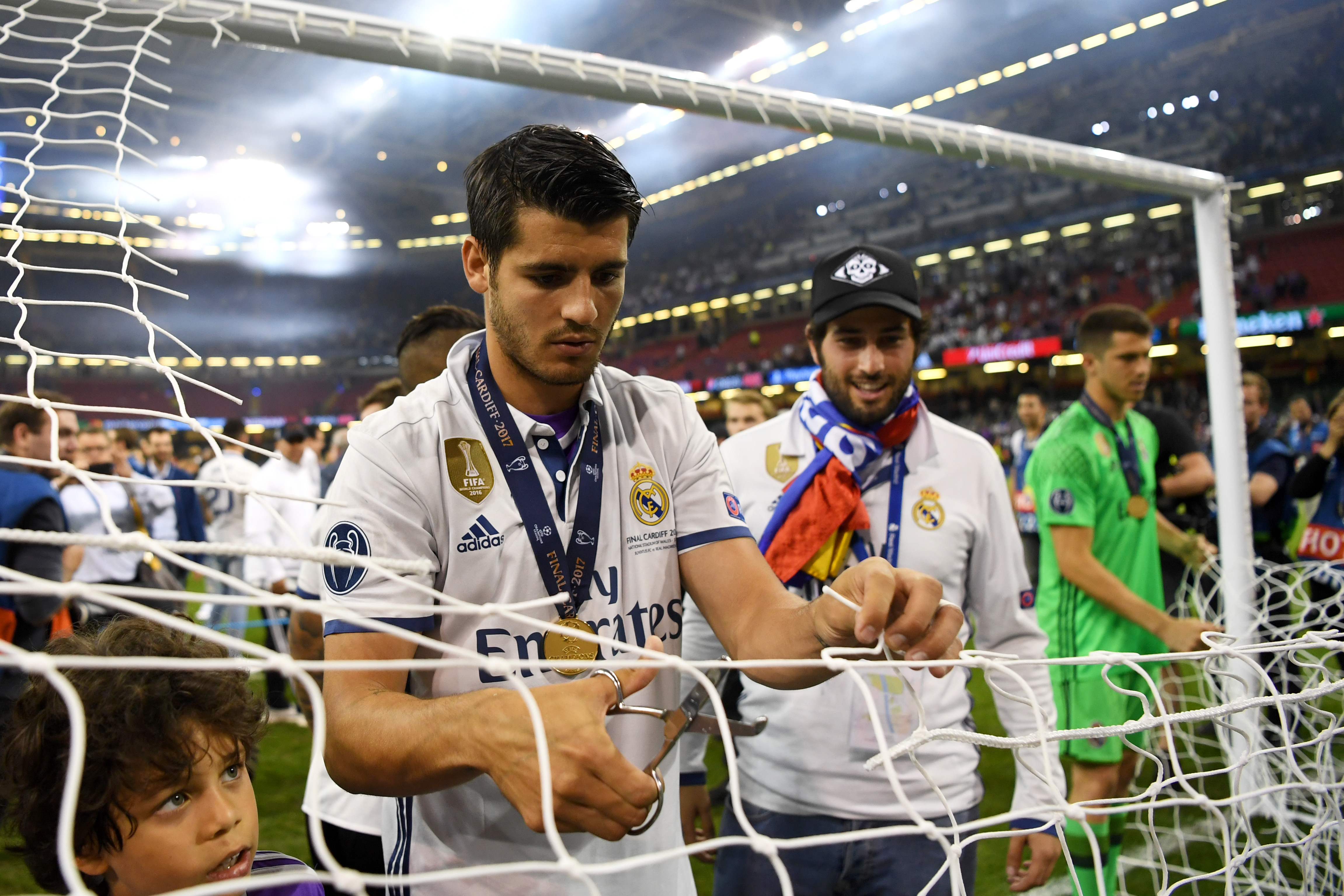CARDIFF, WALES - JUNE 03:  Alvaro Morata of Real Madrid cuts the net after the UEFA Champions League Final between Juventus and Real Madrid at National Stadium of Wales on June 3, 2017 in Cardiff, Wales.  (Photo by Shaun Botterill/Getty Images)