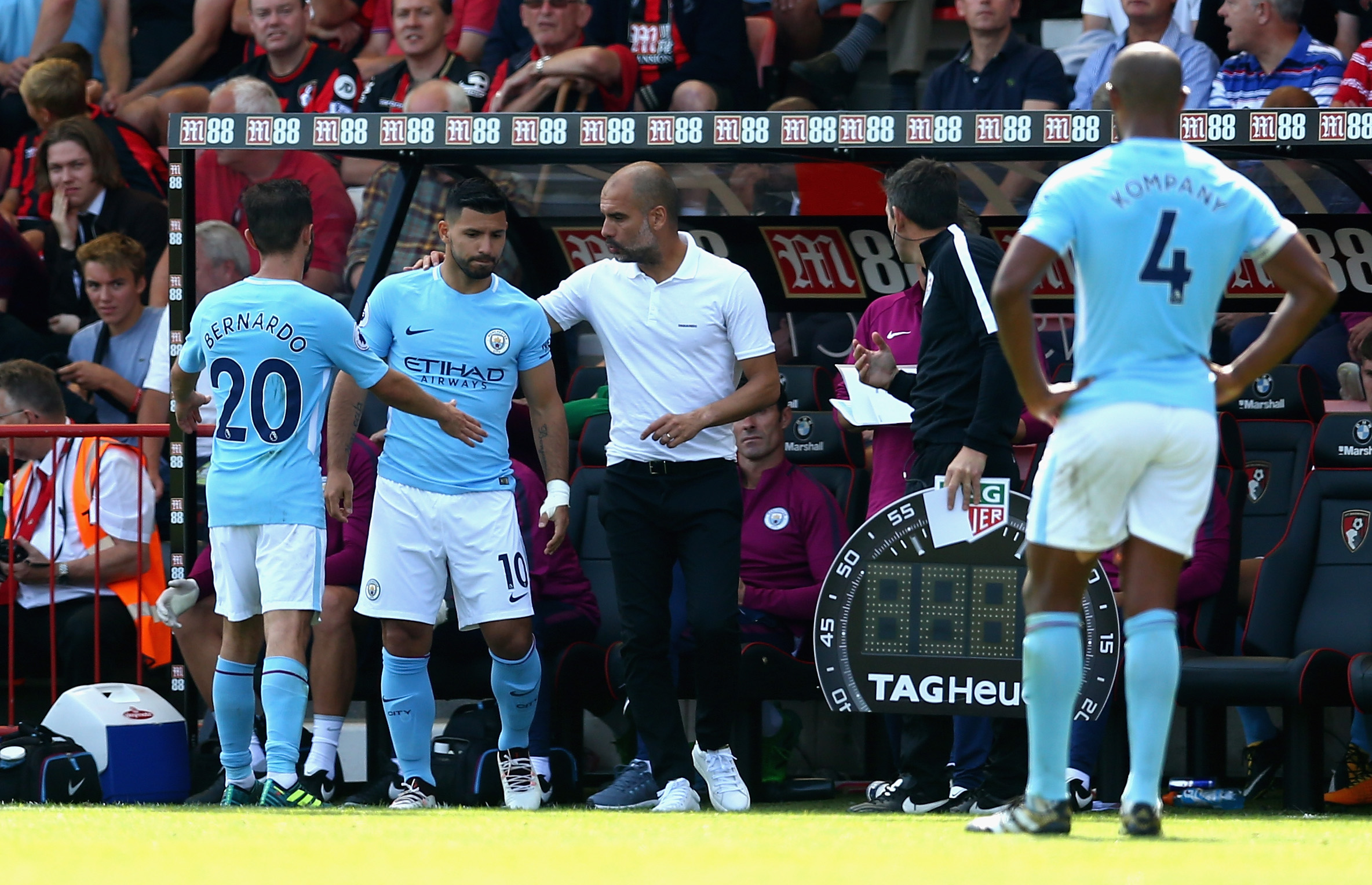 BOURNEMOUTH, ENGLAND - AUGUST 26: Josep Guardiola, Manager of Manchester City gives instructions to Sergio Aguero of Manchester City as he prepares to come on during the Premier League match between AFC Bournemouth and Manchester City at Vitality Stadium on August 26, 2017 in Bournemouth, England.  (Photo by Steve Bardens/Getty Images)