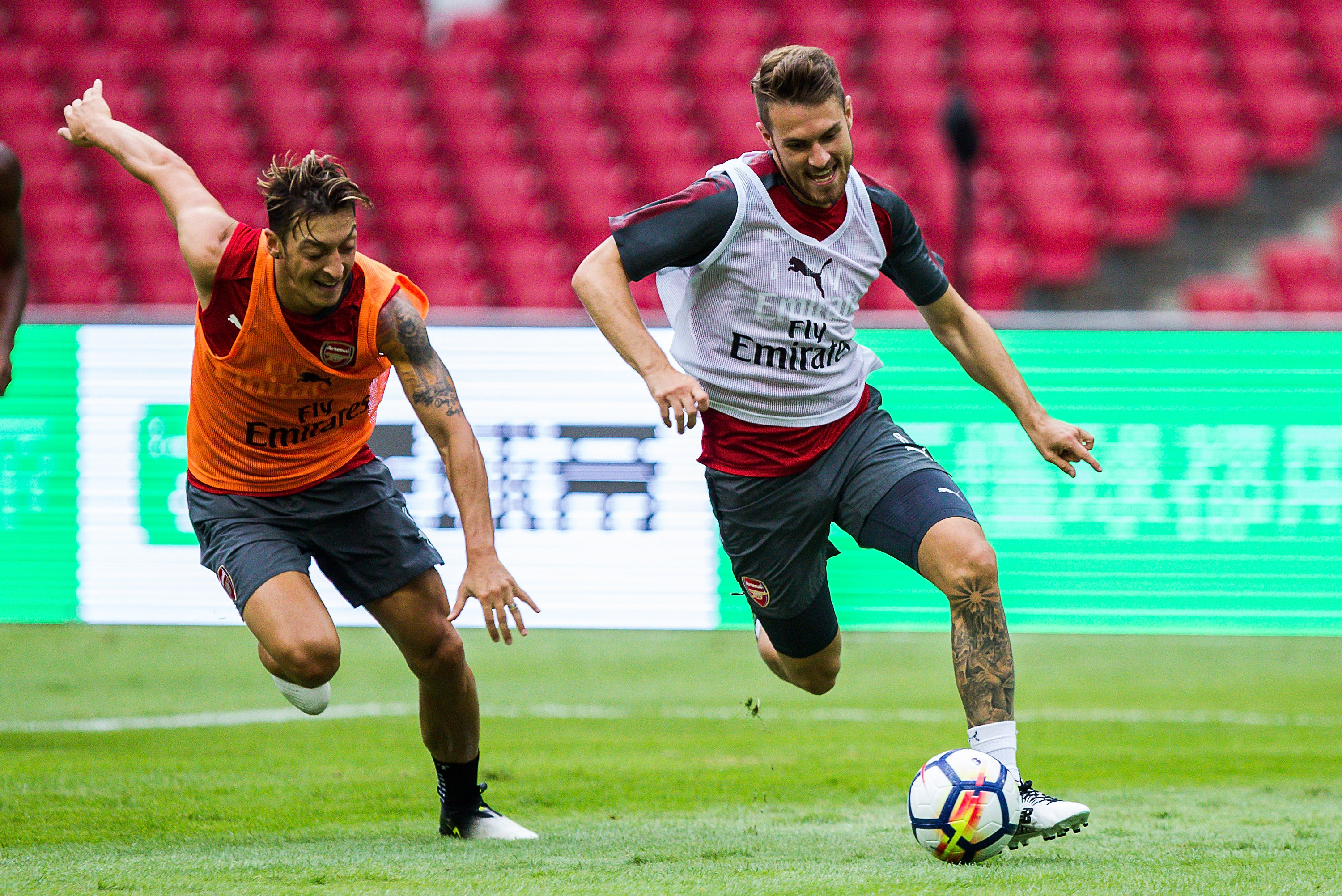 BEIJING, CHINA - JULY 21:  Mesut Ozil  and Aaron Ramsey fight for the ball during a training session at Birds Nest on July 21, 2017 in Beijing, China.  (Photo by Yifan Ding/Getty Images)