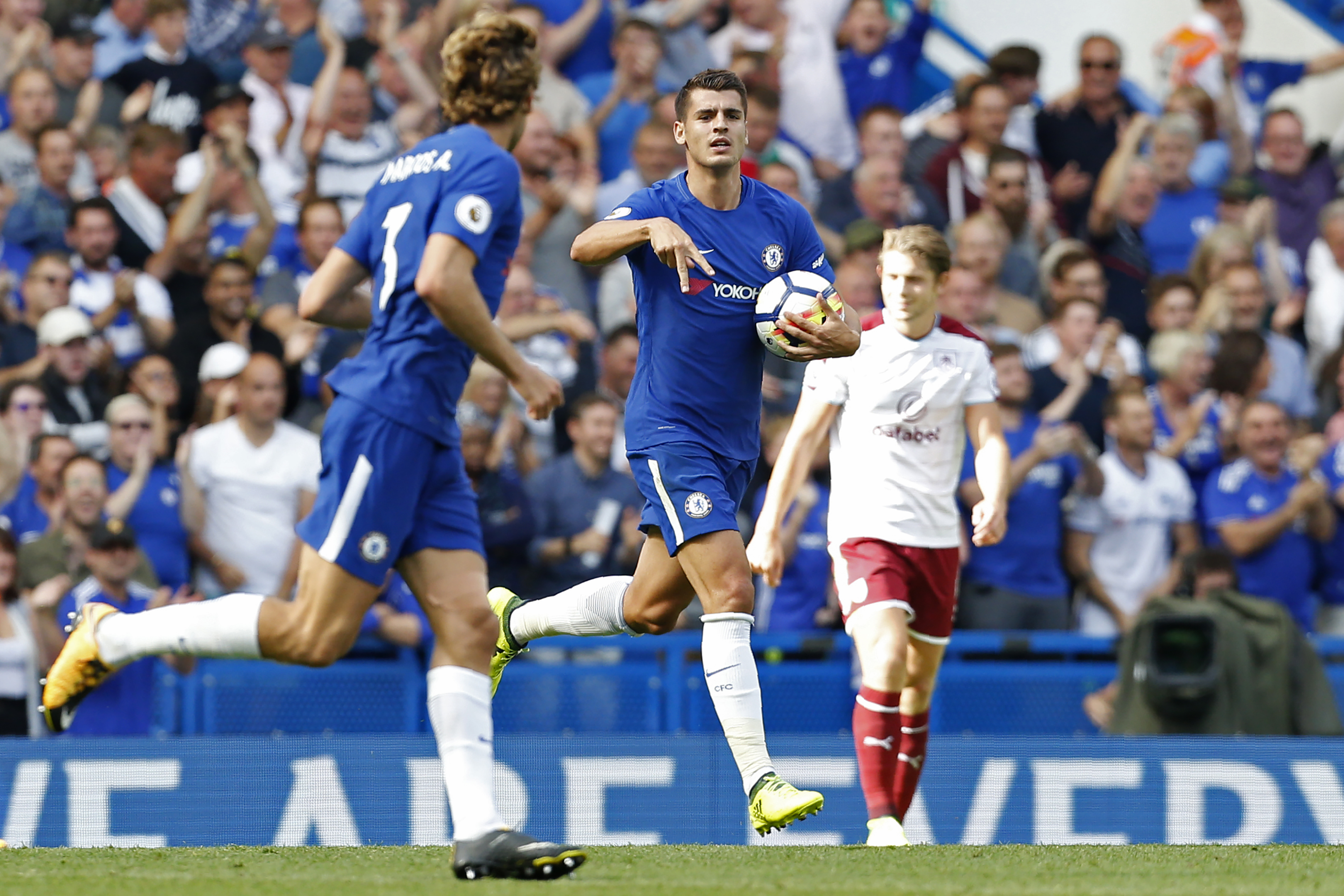 Chelsea's Spanish striker Alvaro Morata (C) celebrates scoring his first Premier League goal during the English Premier League football match between Chelsea and Burnley at Stamford Bridge in London on August 12, 2017. / AFP PHOTO / Ian KINGTON / RESTRICTED TO EDITORIAL USE. No use with unauthorized audio, video, data, fixture lists, club/league logos or 'live' services. Online in-match use limited to 75 images, no video emulation. No use in betting, games or single club/league/player publications.  /         (Photo credit should read IAN KINGTON/AFP/Getty Images)