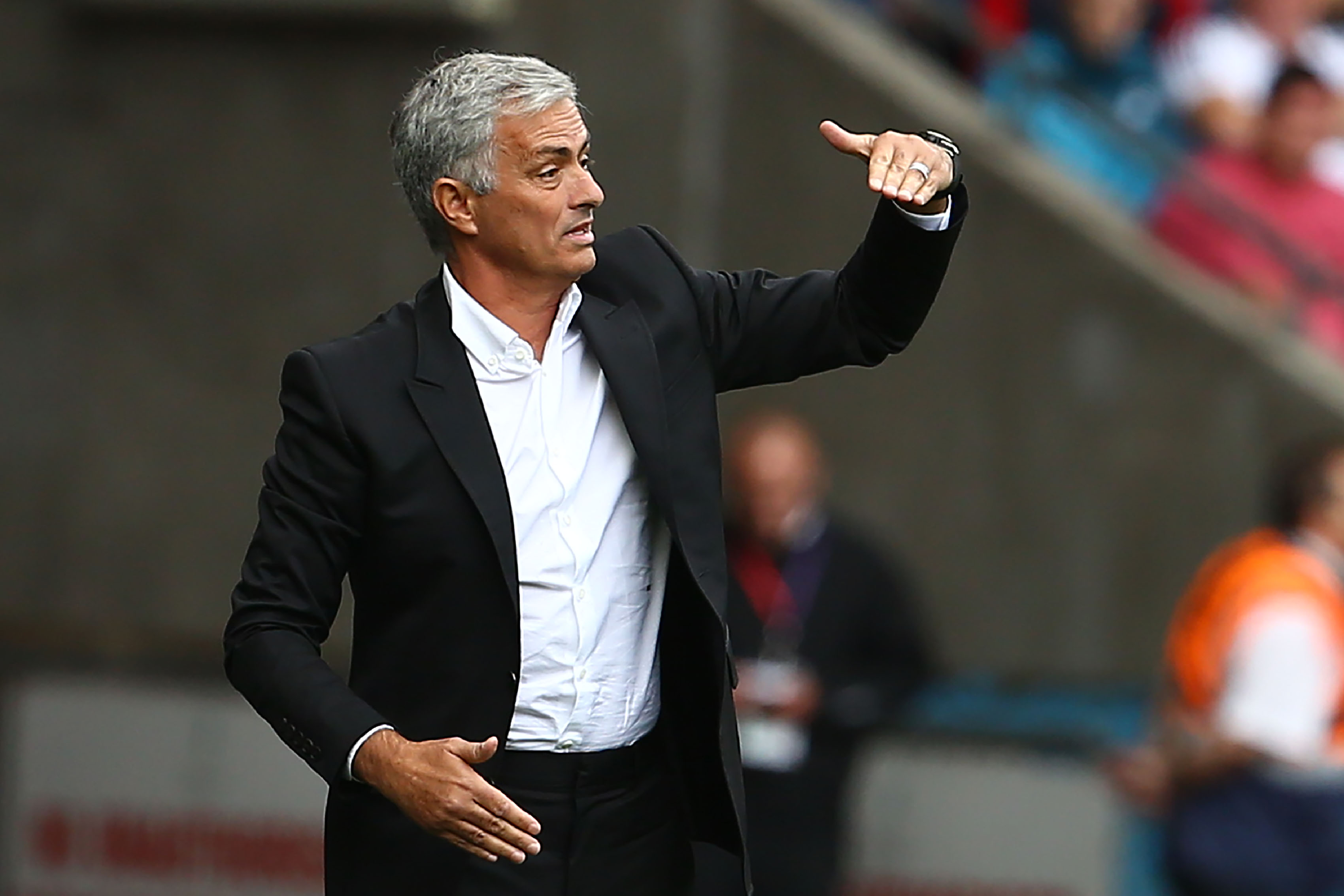 Manchester United's Portuguese manager Jose Mourinho gestures during the English Premier League football match between Swansea City and Manchester United at The Liberty Stadium in Swansea, south Wales on August 19, 2017. / AFP PHOTO / Geoff CADDICK / RESTRICTED TO EDITORIAL USE. No use with unauthorized audio, video, data, fixture lists, club/league logos or 'live' services. Online in-match use limited to 75 images, no video emulation. No use in betting, games or single club/league/player publications.  /         (Photo credit should read GEOFF CADDICK/AFP/Getty Images)